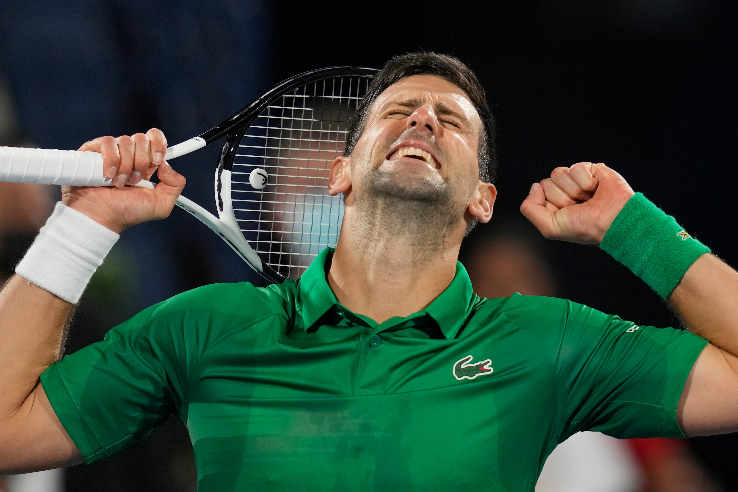 Serbia's Novak Djokovic celebrates winning in two sets against Italy's Lorenzo Musetti during a match of the Dubai Duty Free Tennis Championship in Dubai, United Arab Emirates, Tuesday, Feb. 22, 2022. (AP Photo/Kamran Jebreili)
