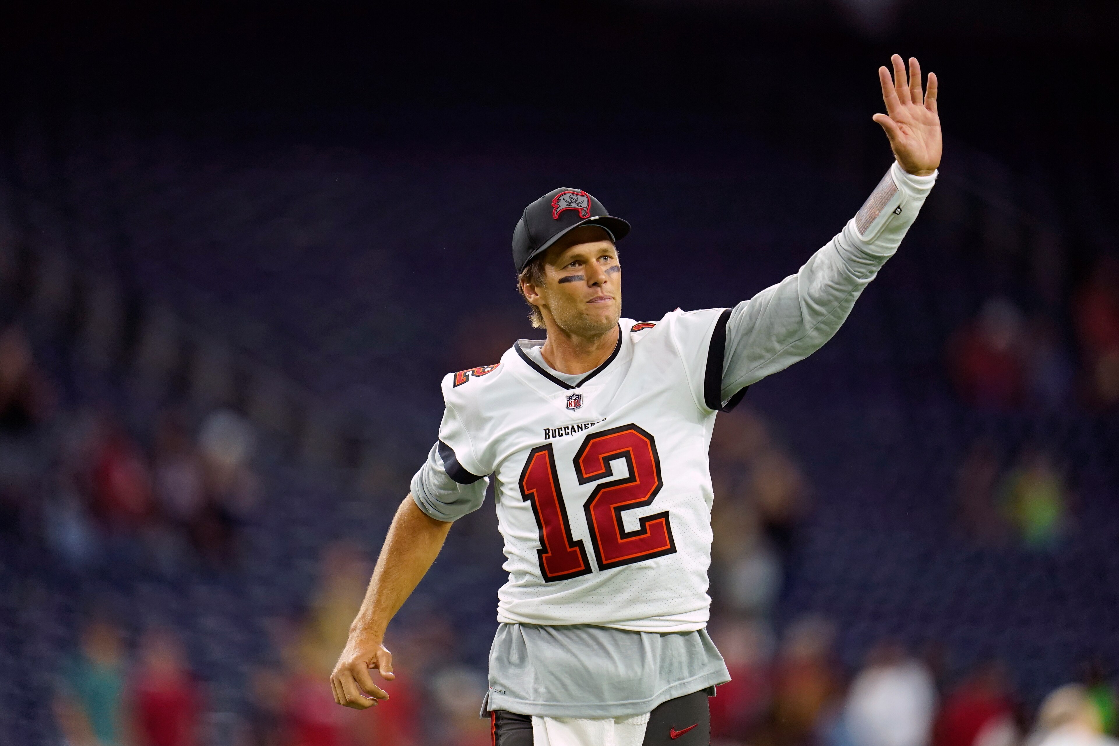 FILE - Tampa Bay Buccaneers quarterback Tom Brady (12) waves toward the fans as he leaves the field after an NFL preseason football game against the Houston Texans, Saturday, Aug. 28, 2021, in Houston. Tom Brady has retired after winning seven Super Bowls and setting numerous passing records in an unprecedented 22-year-career. He made the announcement, Tuesday, Feb. 1, 2022, in a long post on Instagram. (AP Photo/Matt Patterson, File) FILE - Tampa Bay Buccaneers quarterback Tom Brady (12) waves toward the fans as he leaves the field after an NFL preseason football game against the Houston Texans, Saturday, Aug. 28, 2021, in Houston. Tom Brady has retired after winning seven Super Bowls and setting numerous passing records in an unprecedented 22-year-career. He made the announcement, Tuesday, Feb. 1, 2022, in a long post on Instagram. (AP Photo/Matt Patterson, File)