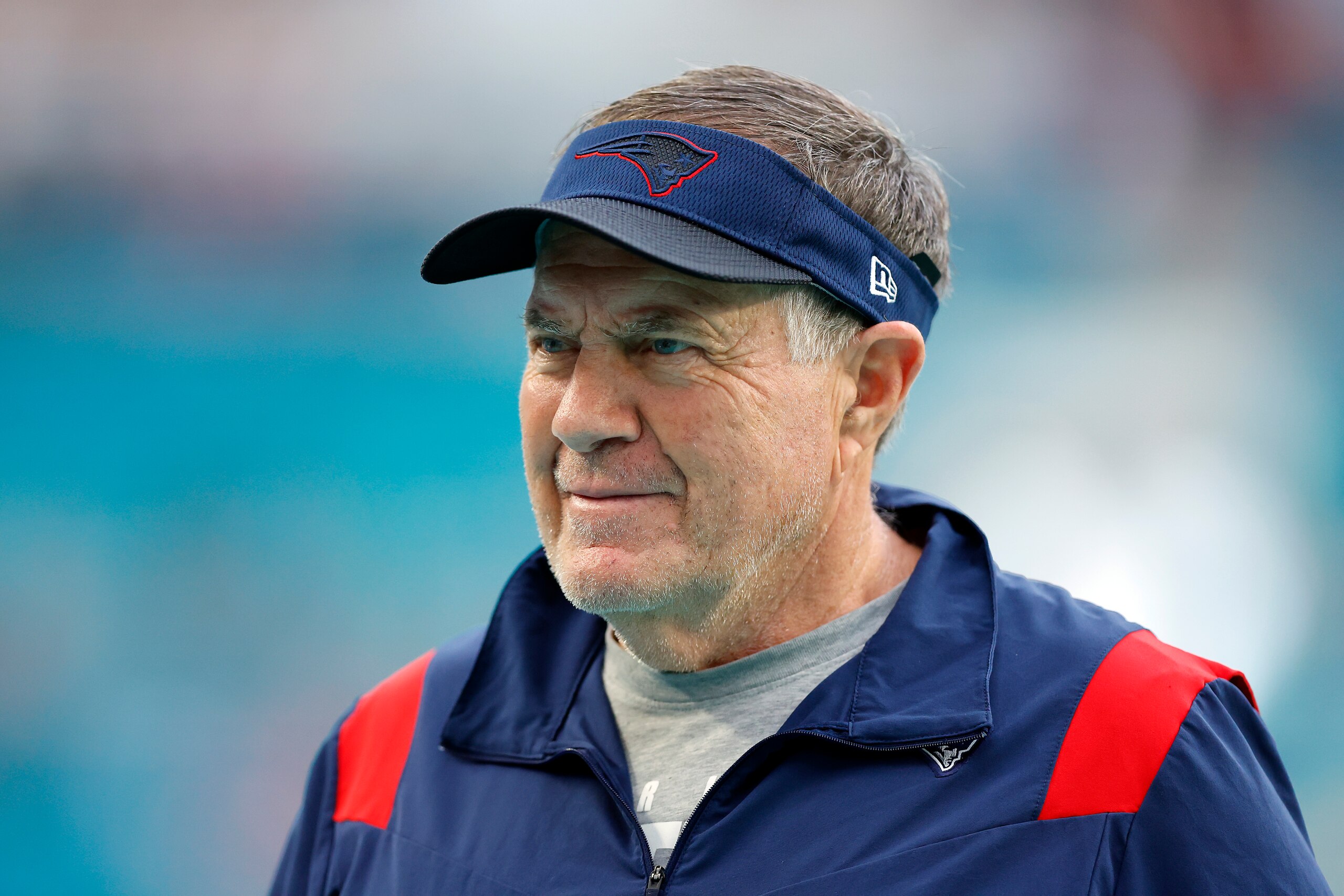 MIAMI GARDENS, FLORIDA - JANUARY 09: Head coach Bill Belichick of the New England Patriots  looks on during warm ups prior to the game against the Miami Dolphins at Hard Rock Stadium on January 09, 2022 in Miami Gardens, Florida. (Photo by Michael Reaves/Getty Images)