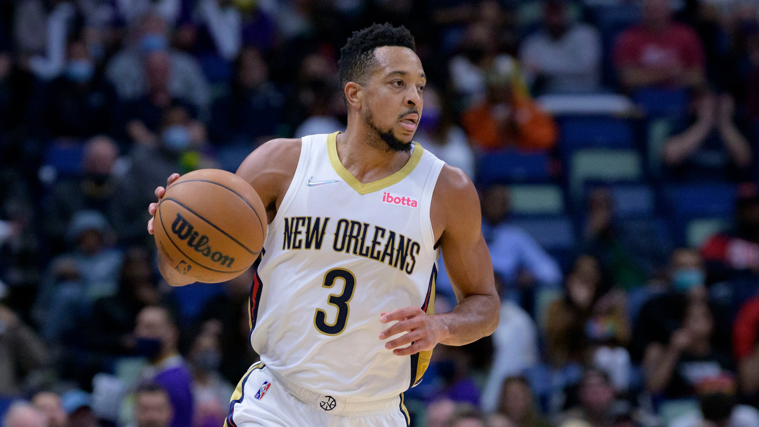 New Orleans Pelicans guard CJ McCollum (3) dribbles during an NBA basketball game against the Dallas Mavericks in New Orleans, Thursday, Feb. 17, 2022. (AP Photo/Matthew Hinton)