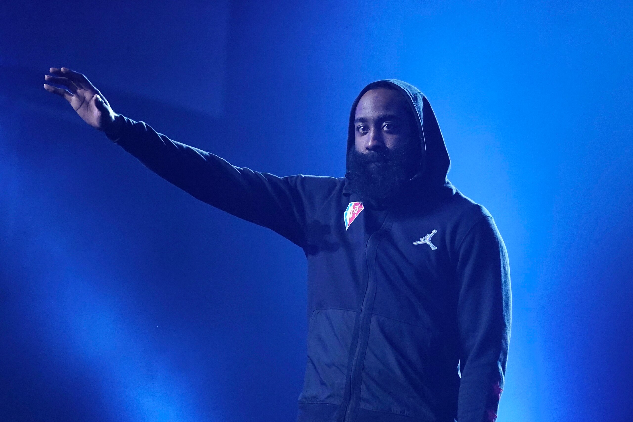 Brooklyn Nets' James Harden waves as the crowd "boos" as he is introduced for the NBA All-Star basketball game, Sunday, Feb. 20, 2022, in Cleveland. It was announced he would not play due to injury. (AP Photo/Charles Krupa)