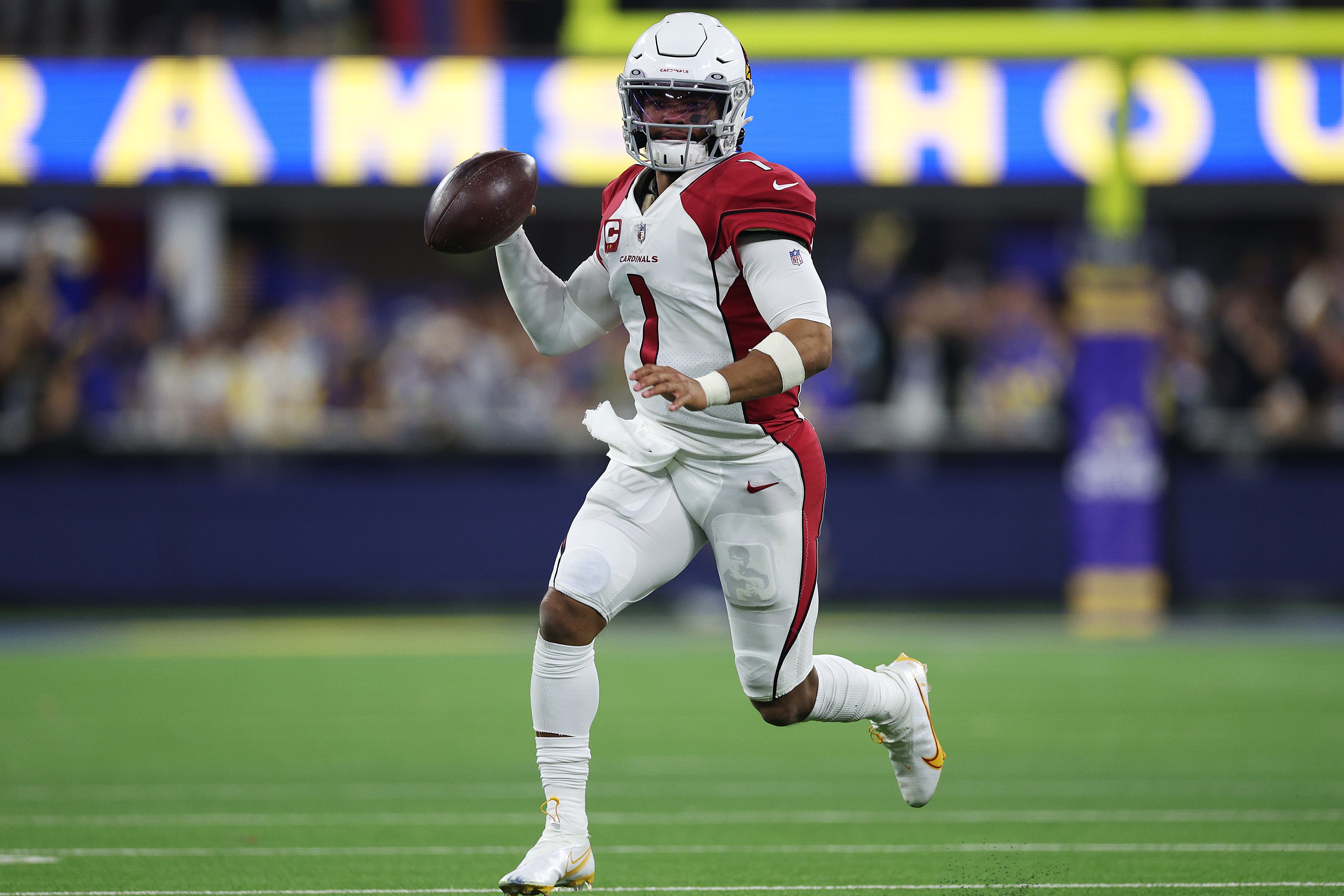 INGLEWOOD, CALIFORNIA - JANUARY 17: Kyler Murray #1 of the Arizona Cardinals scrambles against the Los Angeles Rams during the fourth quarter in the NFC Wild Card Playoff game at SoFi Stadium on January 17, 2022 in Inglewood, California. (Photo by Harry How/Getty Images)