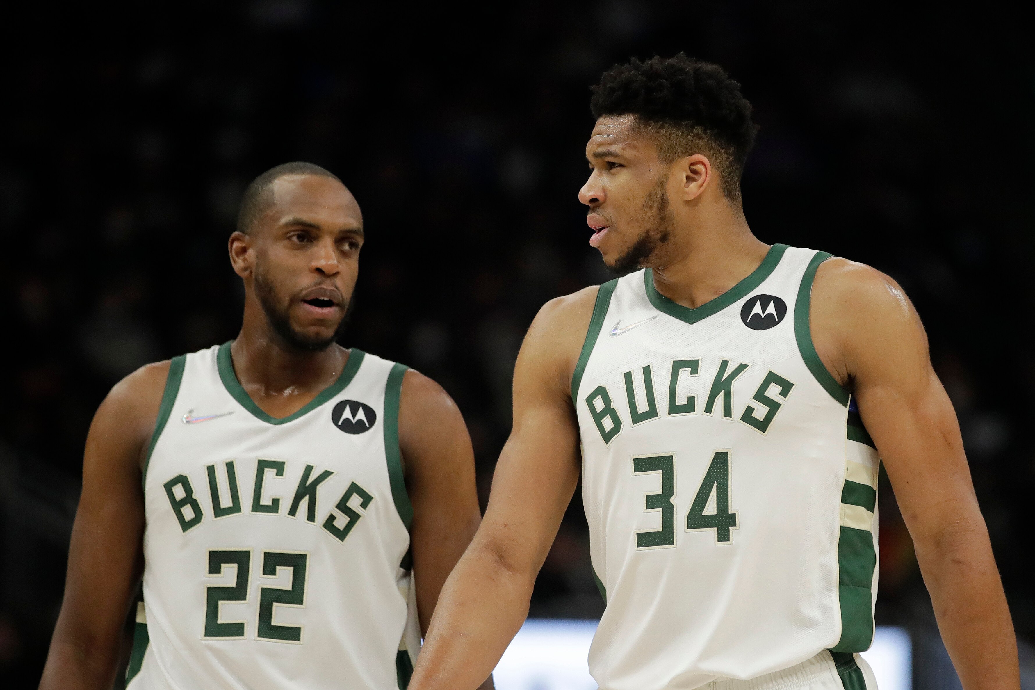 Milwaukee Bucks' Giannis Antetokounmpo (34) talks with Khris Middleton (22) during the first half of an NBA basketball game against the Indiana Pacers Tuesday, Feb. 15, 2022, in Milwaukee. (AP Photo/Aaron Gash)