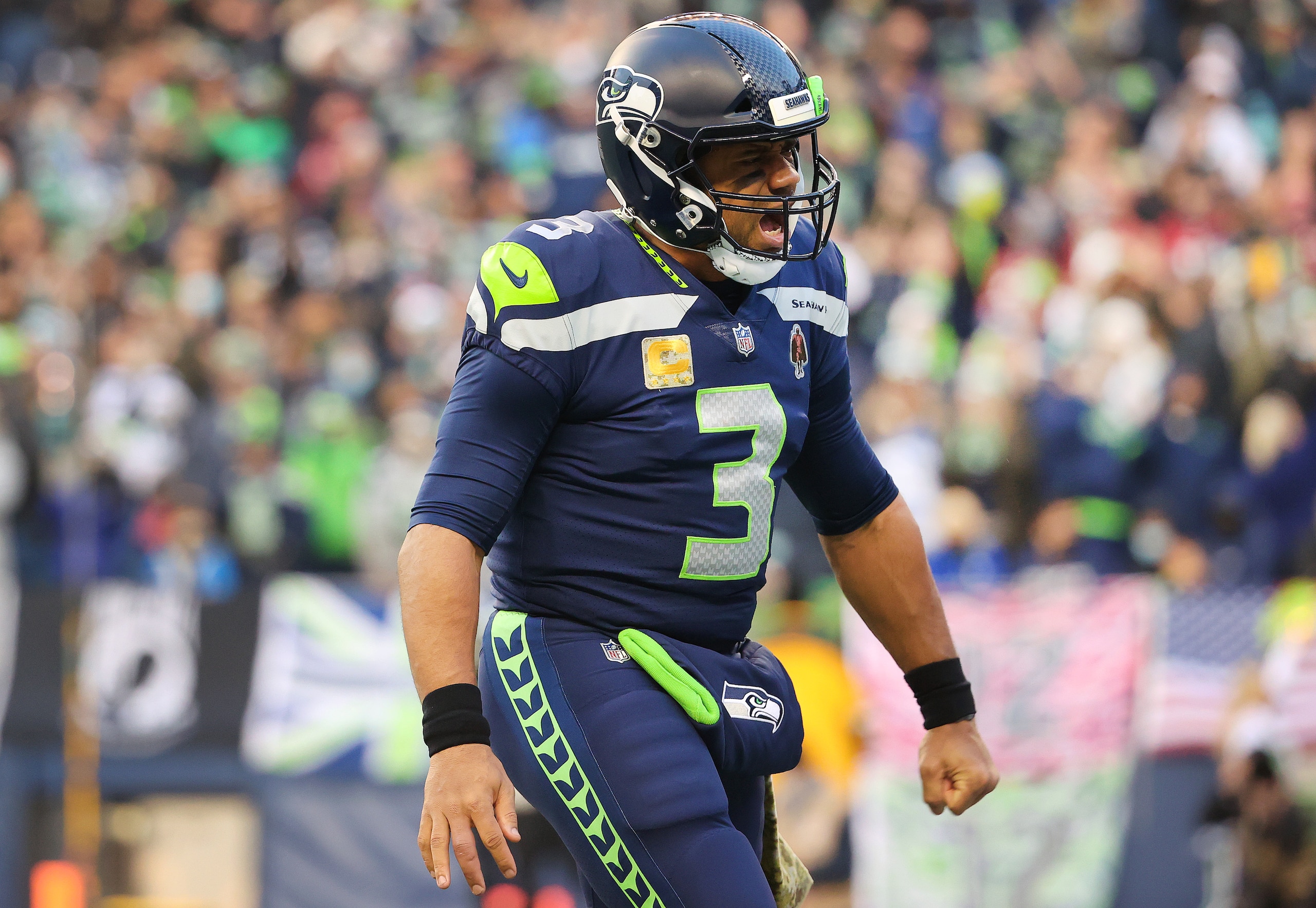 SEATTLE, WASHINGTON - NOVEMBER 21: Russell Wilson #3 of the Seattle Seahawks celebrates after a Seattle touchdown during the fourth quarter against the Arizona Cardinals at Lumen Field on November 21, 2021 in Seattle, Washington. (Photo by Abbie Parr/Getty Images)