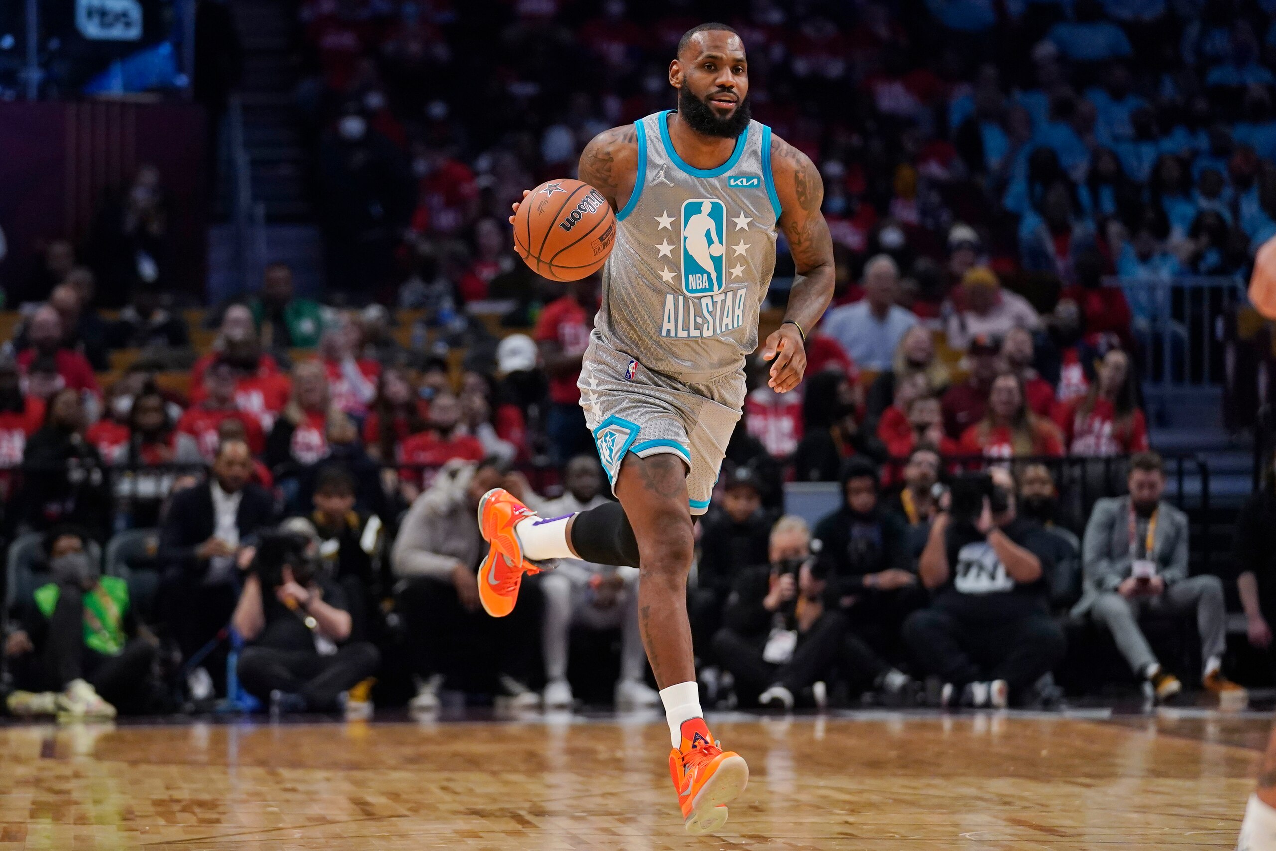 Los Angeles Lakers' LeBron James dribbles down court during the NBA All-Star game in Cleveland, Sunday, Feb. 20, 2022. (AP Photo/Charles Krupa)