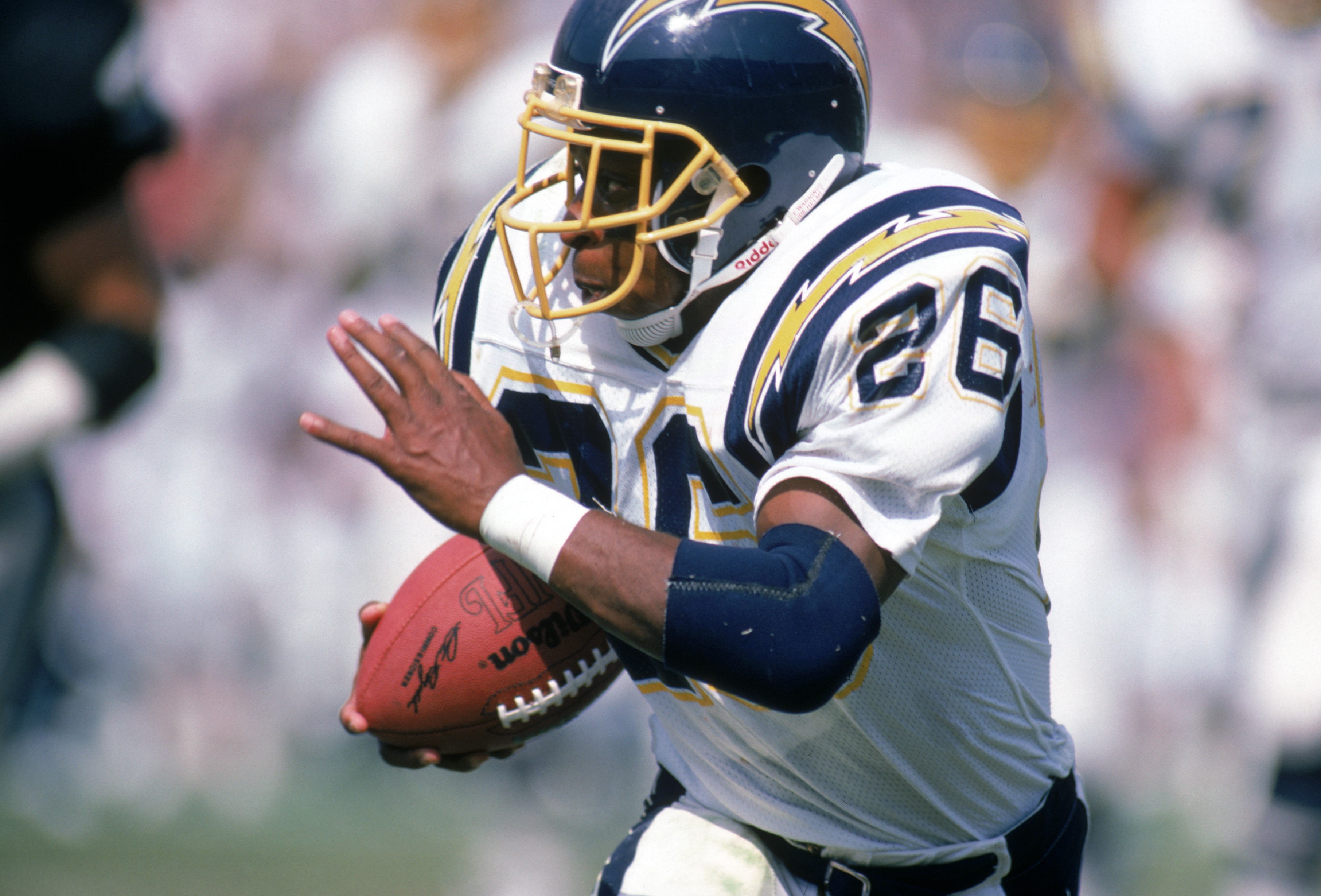 LOS ANGELES - SEPTEMBER 28:  Running back Lionel James #26 of the San Diego Chargers runs with the ball during a game against the Los Angeles Raiders at the Los Angeles Memorial Coliseum on September 28, 1986 in Los Angeles, California.  The Raiders won 17-13.  (Photo by George Rose/Getty Images)