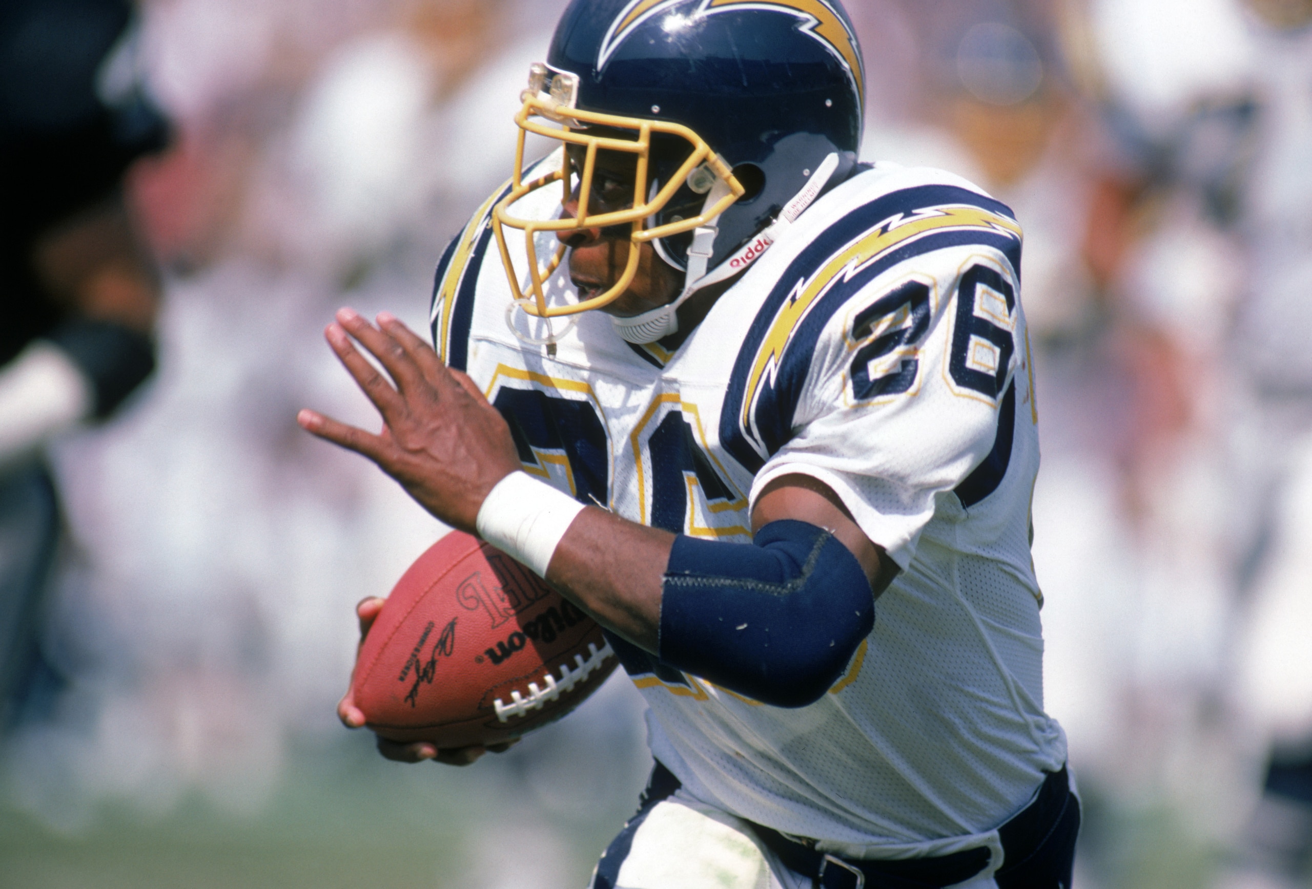 LOS ANGELES - SEPTEMBER 28:  Running back Lionel James #26 of the San Diego Chargers runs with the ball during a game against the Los Angeles Raiders at the Los Angeles Memorial Coliseum on September 28, 1986 in Los Angeles, California.  The Raiders won 17-13.  (Photo by George Rose/Getty Images)