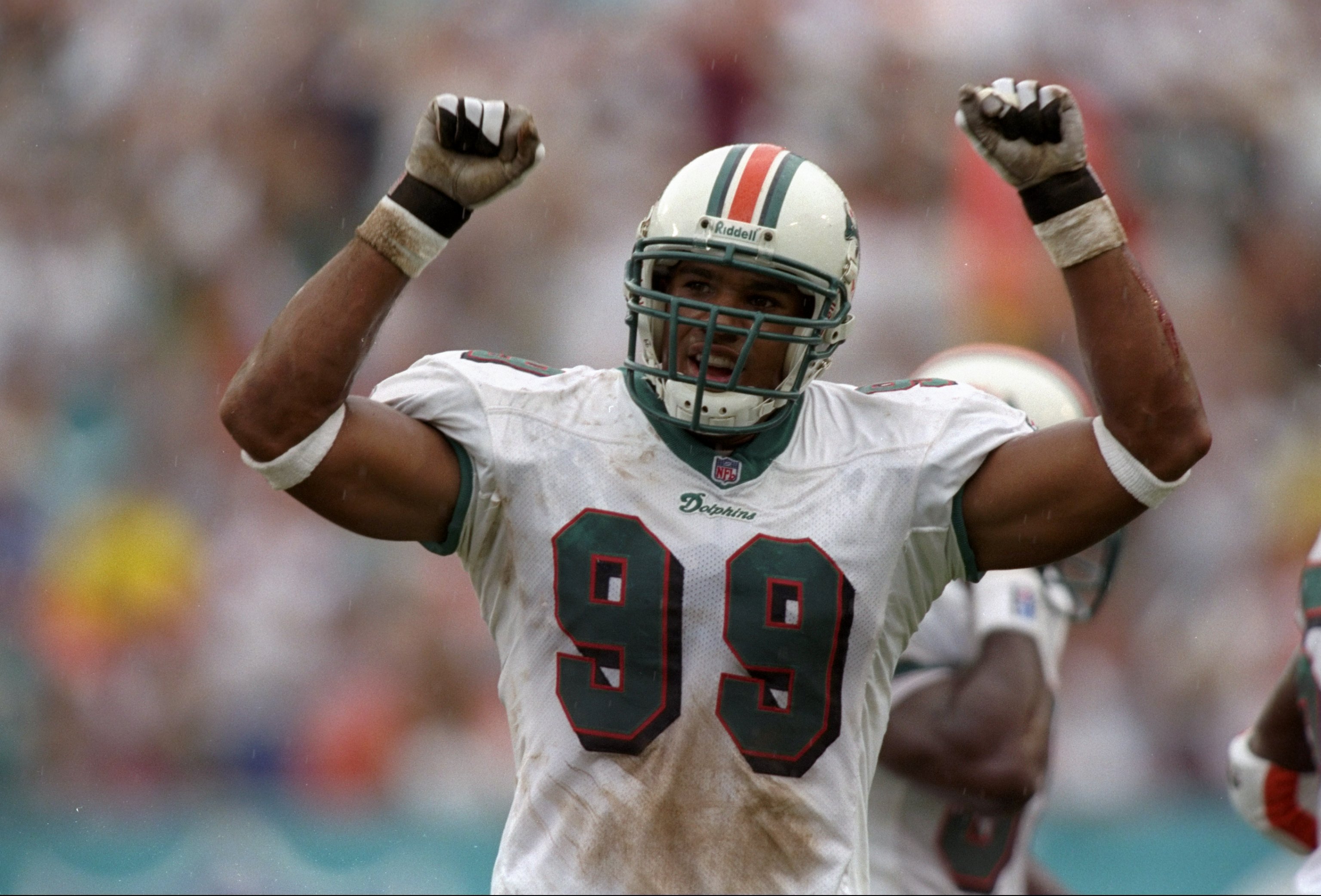 31 Aug 1997:  Defensive lineman Jason Taylor of the Miami Dolphins celebrates during the Dolphins 16-10 win over the Indianapolis Colts at Pro Player Stadium in Miami, Florida. Mandatory Credit: Andy Lyons  /Allsport