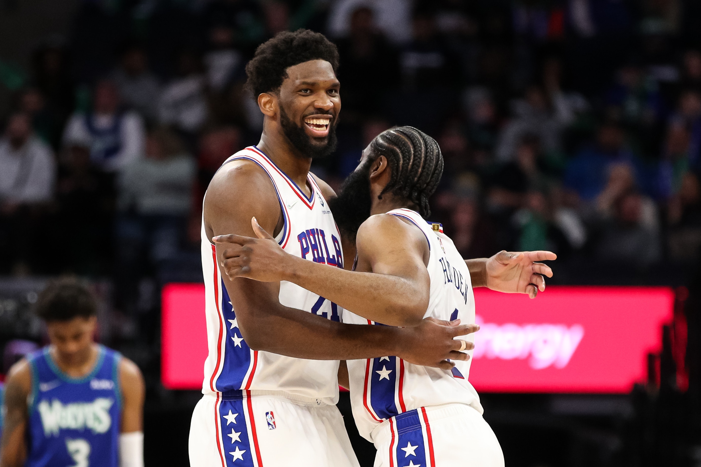 MINNEAPOLIS, MN - FEBRUARY 25: Joel Embiid #21 and James Harden #1 of the Philadelphia 76ers celebrate after Harden drew a foul against Karl-Anthony Towns #32 of the Minnesota Timberwolves (not pictured) in the fourth quarter of the game at Target Center on February 25, 2022 in Minneapolis, Minnesota. The 76ers defeated the Timberwolves 133-102. NOTE TO USER: User expressly acknowledges and agrees that, by downloading and or using this Photograph, user is consenting to the terms and conditions of the Getty Images License Agreement. (Photo by David Berding/Getty Images)