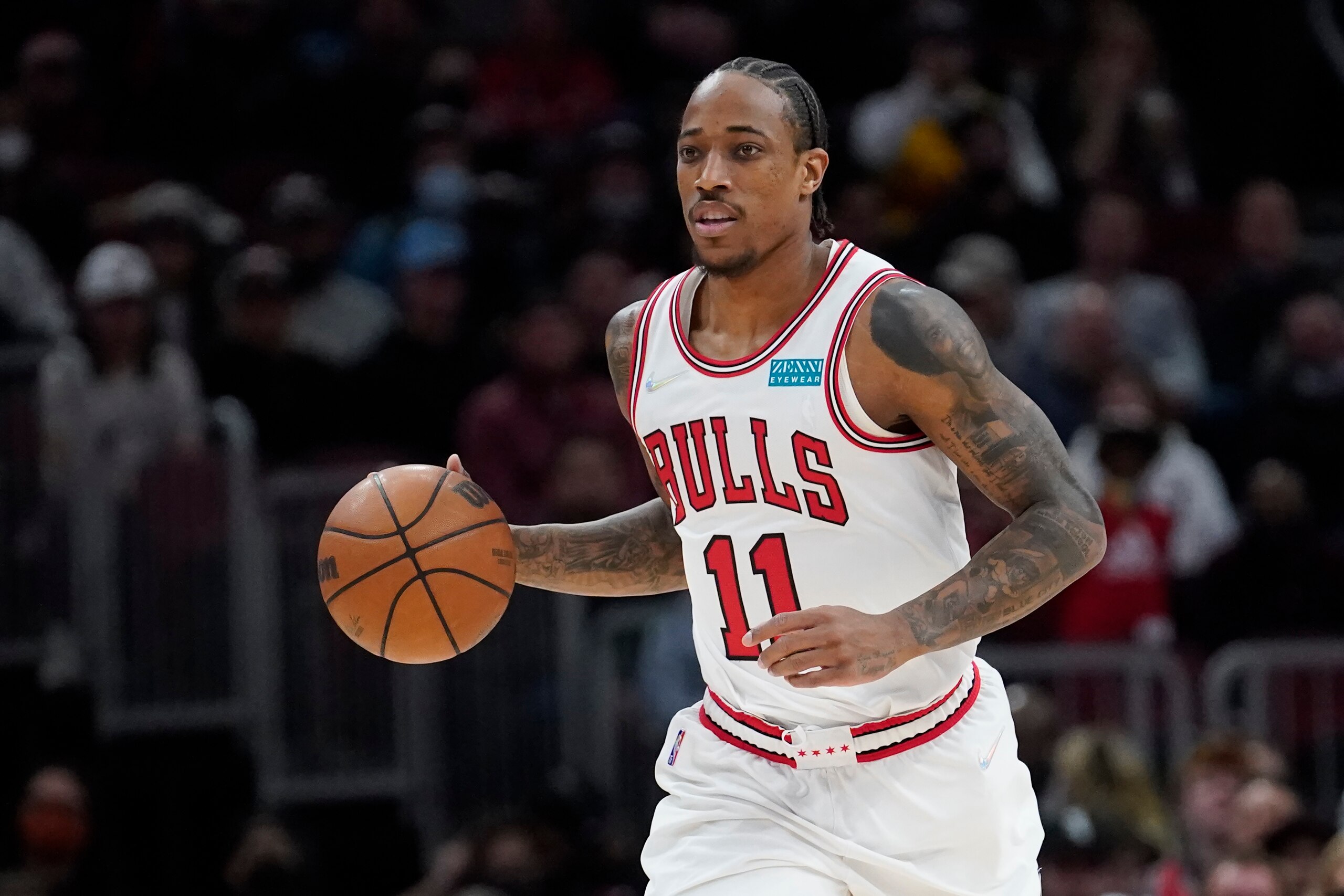 Chicago Bulls' DeMar DeRozan brings the ball up court during the first half of an NBA basketball game against the Atlanta Hawks Thursday, Feb. 24, 2022, in Chicago. (AP Photo/Charles Rex Arbogast)