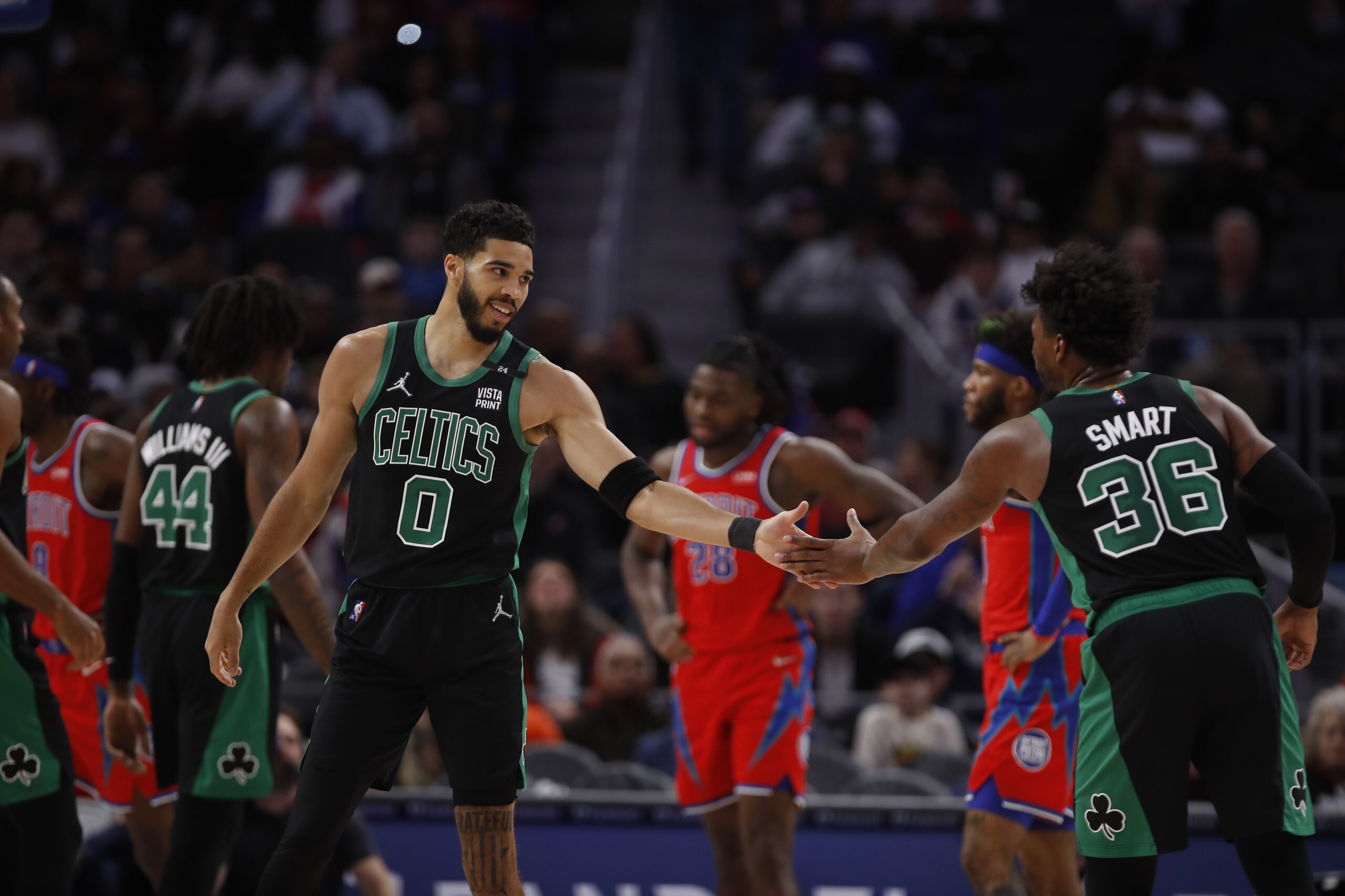 DETROIT, MI - FEBRUARY 26: Jayson Tatum #0 high fives team mate Marcus Smart #36 of the Boston Celtics during the game against the Detroit Pistons on February 24, 2022 at Little Caesars Arena in Detroit, Michigan. NOTE TO USER: User expressly acknowledges and agrees that, by downloading and/or using this photograph, User is consenting to the terms and conditions of the Getty Images License Agreement. Mandatory Copyright Notice: Copyright 2022 NBAE (Photo by Brian Sevald/NBAE via Getty Images)