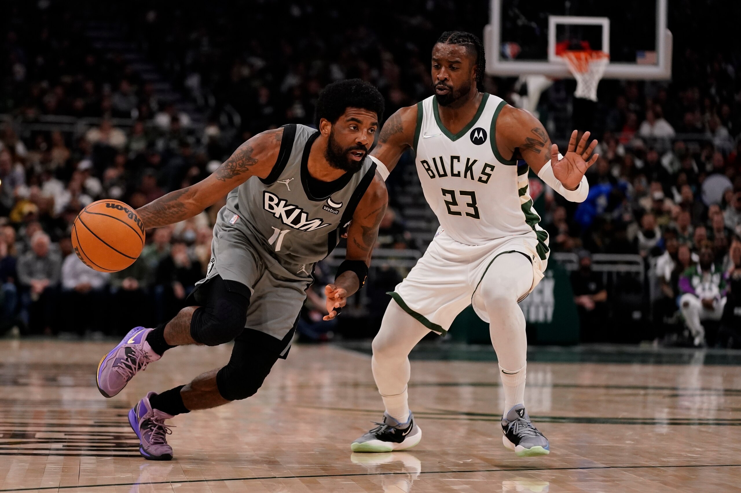 Brooklyn Nets' Kyrie Irving drives past Milwaukee Bucks' Wesley Matthews during the first half of an NBA basketball game Saturday, Feb. 26, 2022, in Milwaukee. (AP Photo/Morry Gash) Brooklyn Nets' Kyrie Irving drives past Milwaukee Bucks' Wesley Matthews during the first half of an NBA basketball game Saturday, Feb. 26, 2022, in Milwaukee. (AP Photo/Morry Gash)