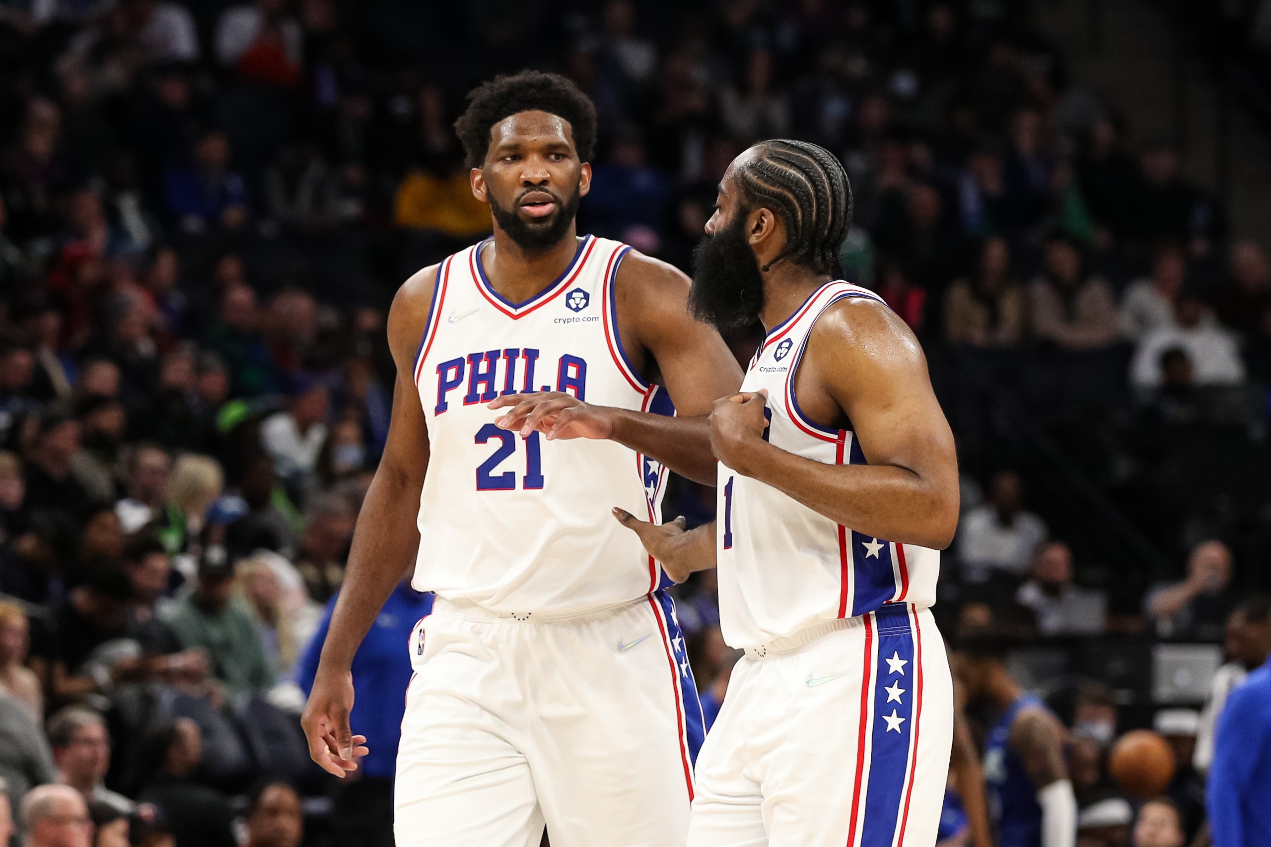 MINNEAPOLIS, MN - FEBRUARY 25: Joel Embiid #21 celebrates with James Harden #1 of the Philadelphia 76ers after making a basket against the Minnesota Timberwolves in the fourth quarter of the game at Target Center on February 25, 2022 in Minneapolis, Minnesota. The 76ers defeated the Timberwolves 133-102. NOTE TO USER: User expressly acknowledges and agrees that, by downloading and or using this Photograph, user is consenting to the terms and conditions of the Getty Images License Agreement. (Photo by David Berding/Getty Images)