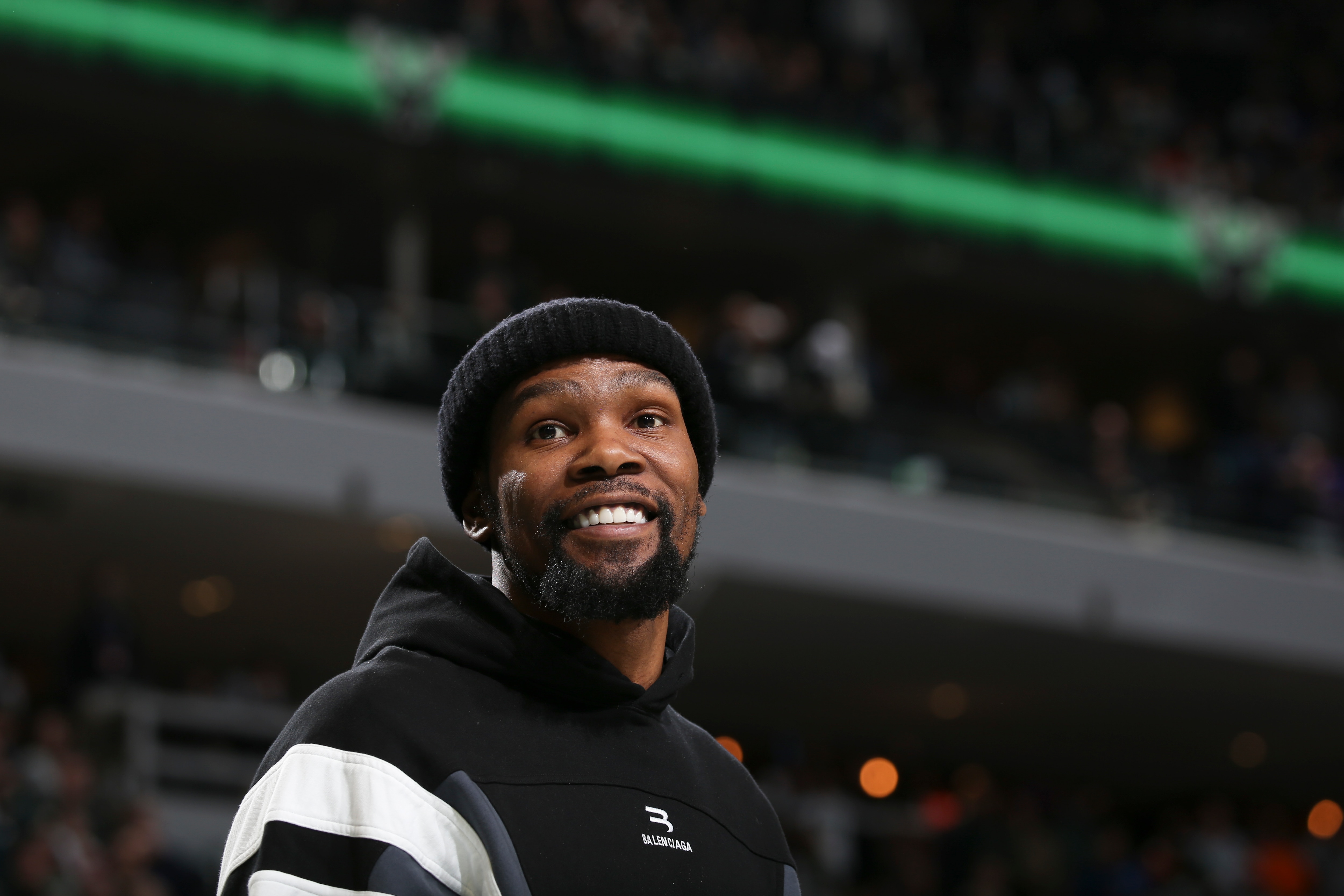 MILWAUKEE, WI - FEBRUARY 26: Kevin Durant #7 of the Brooklyn Nets smiles during the game against the Milwaukee Bucks on February 26, 2022 at the Fiserv Forum Center in Milwaukee, Wisconsin. NOTE TO USER: User expressly acknowledges and agrees that, by downloading and or using this Photograph, user is consenting to the terms and conditions of the Getty Images License Agreement. Mandatory Copyright Notice: Copyright 2022 NBAE (Photo by Gary Dineen/NBAE via Getty Images).