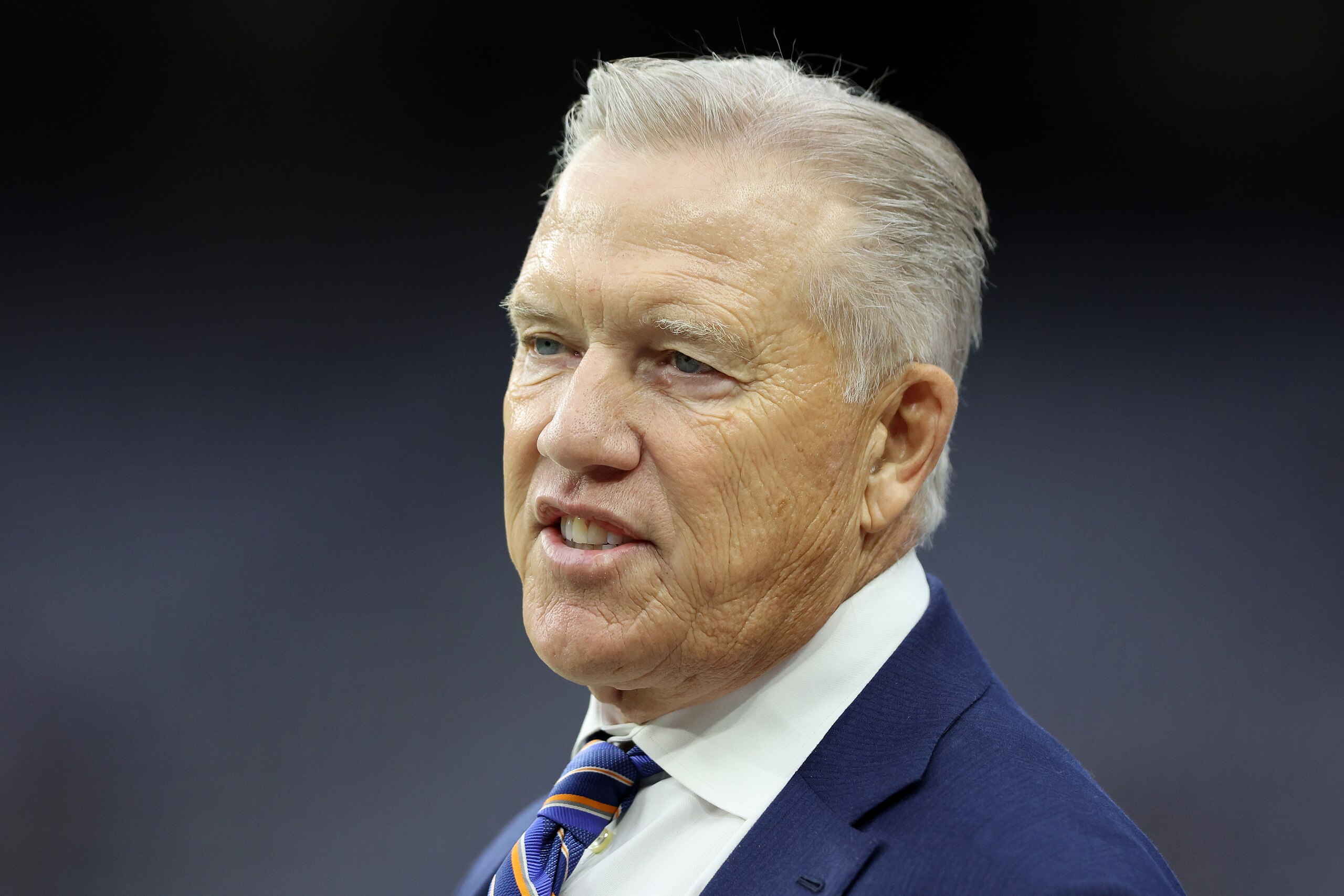LAS VEGAS, NEVADA - DECEMBER 26: President of football operations John Elway of the Denver Broncos looks on during pre-game before the game against the Las Vegas Raiders at Allegiant Stadium on December 26, 2021 in Las Vegas, Nevada. (Photo by Matthew Stockman/Getty Images)