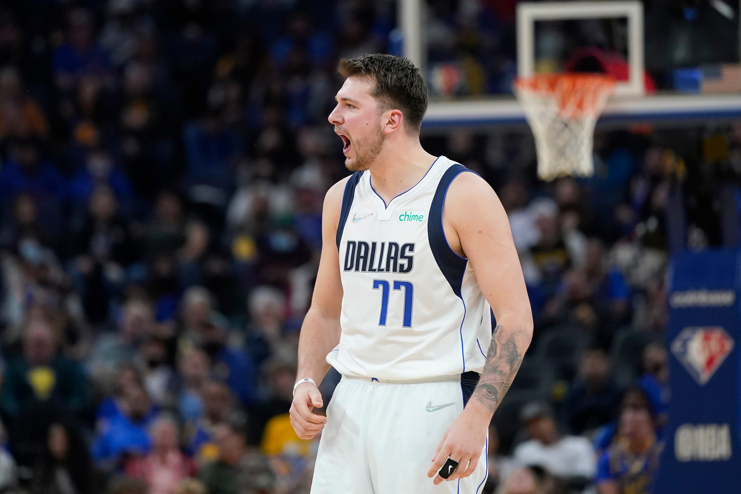 Dallas Mavericks guard Luka Doncic (77) reacts toward officials during the first half of an NBA basketball game against the Golden State Warriors in San Francisco, Sunday, Feb. 27, 2022. (AP Photo/Jeff Chiu)