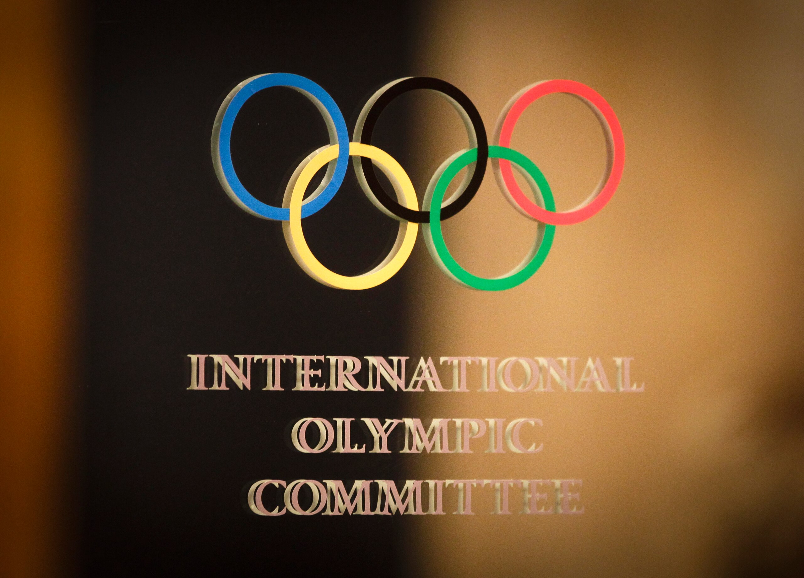 The International Olympic Committee (IOC) logo is seen on the door at a meeting of the IOC Executive Board at a hotel in London, prior to the 2012 Summer Olympics, Saturday, July 21, 2012. (AP Photo/Ben Curtis)