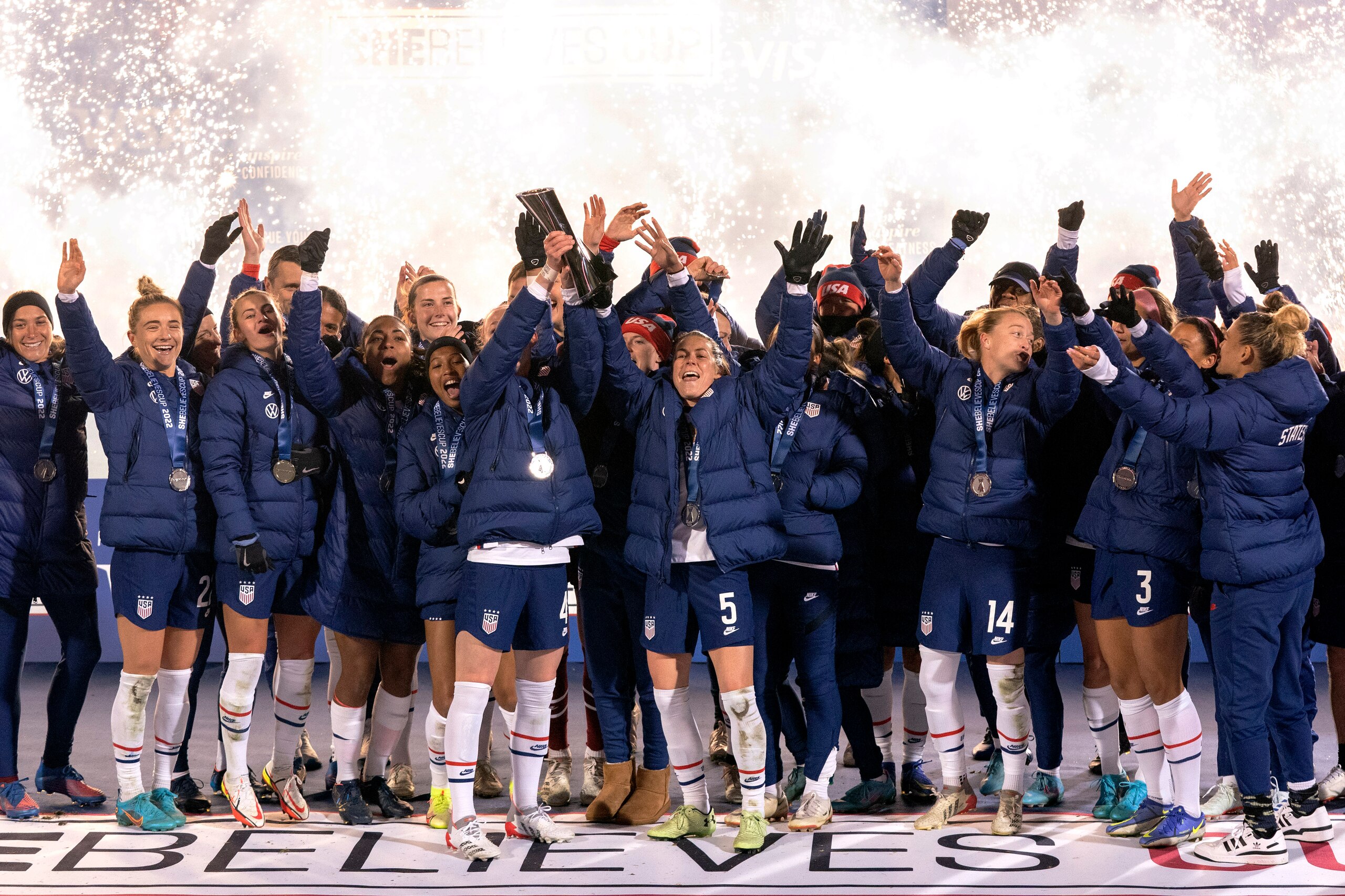 The U.S. team hoists the SheBelieves Cup trophy after a 5-0 win over Iceland in a soccer match Wednesday, Feb. 23, 2022 in Frisco, Texas. (AP Photo/Jeffrey McWhorter)