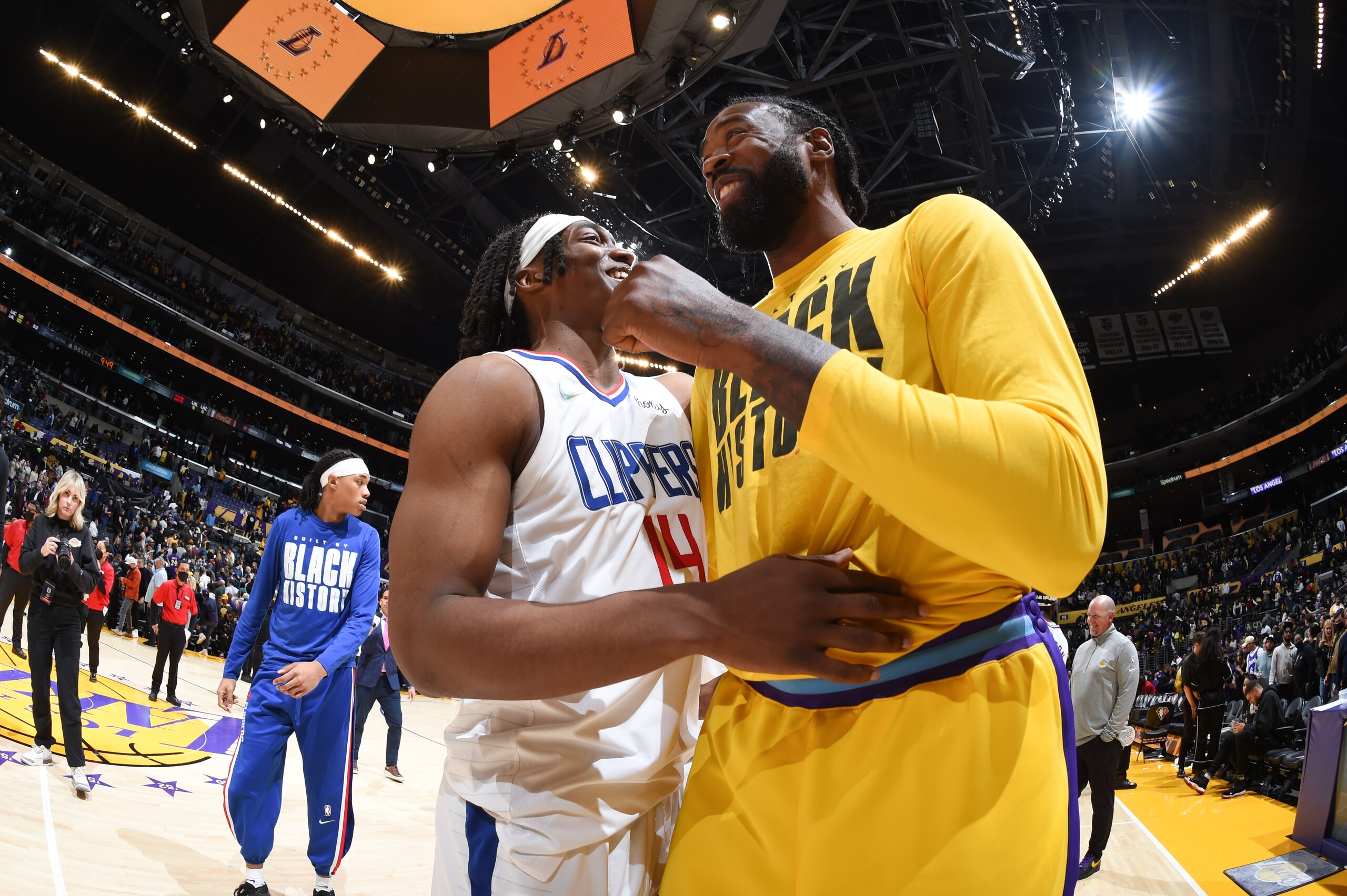 LOS ANGELES, CA - FEBRUARY 25: Terance Mann #14 of the LA Clippers talks to DeAndre Jordan #10 of the Los Angeles Lakers after the game on February 25, 2022 at Crypto.Com Arena in Los Angeles, California. NOTE TO USER: User expressly acknowledges and agrees that, by downloading and/or using this Photograph, user is consenting to the terms and conditions of the Getty Images License Agreement. Mandatory Copyright Notice: Copyright 2022 NBAE (Photo by Andrew D. Bernstein/NBAE via Getty Images)