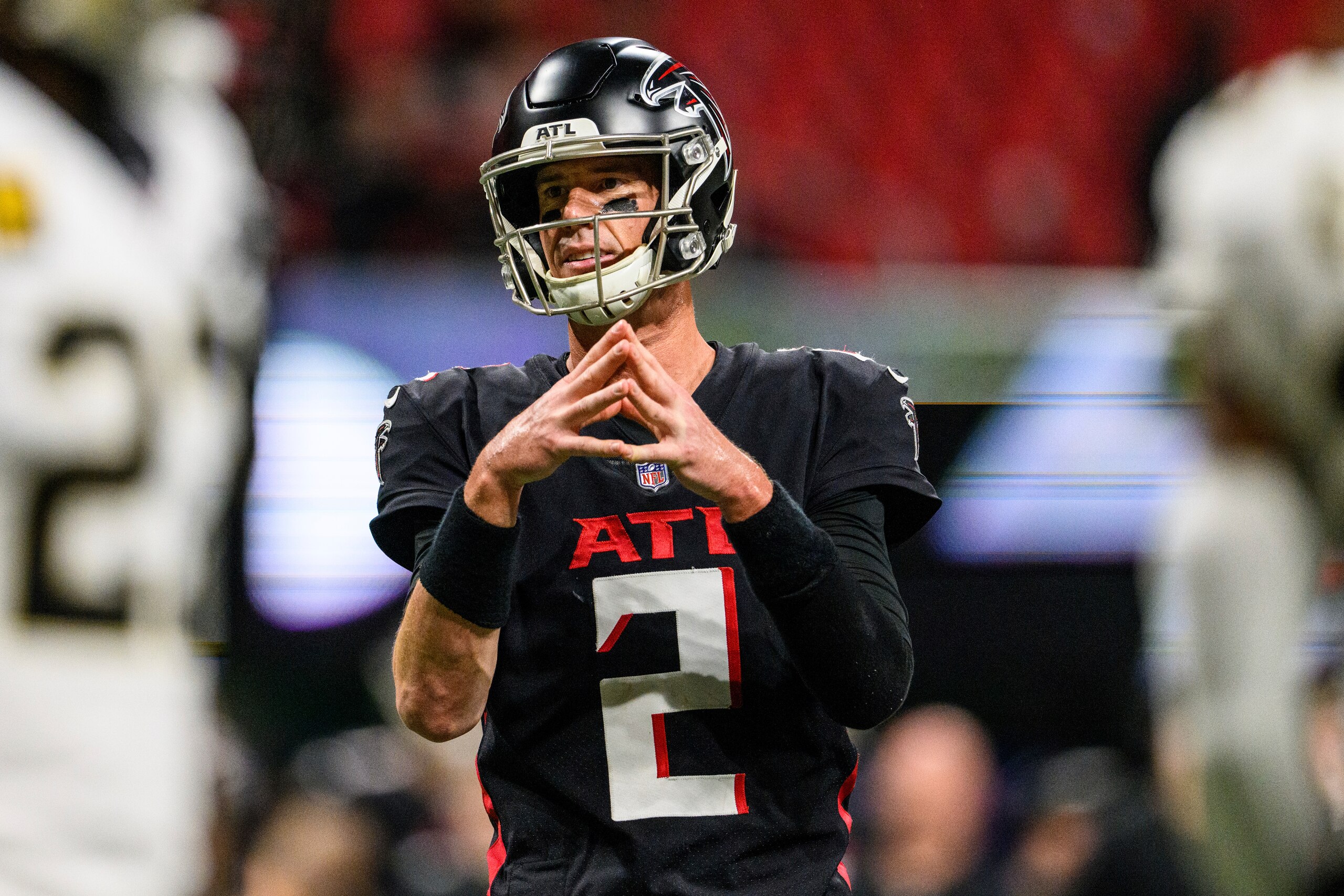 Atlanta Falcons quarterback Matt Ryan (2) signals during the second half of an NFL football game against the New Orleans Saints, Sunday, Jan. 9, 2022, in Atlanta. The New Orleans Saints won 30-20. (AP Photo/Danny Karnik)