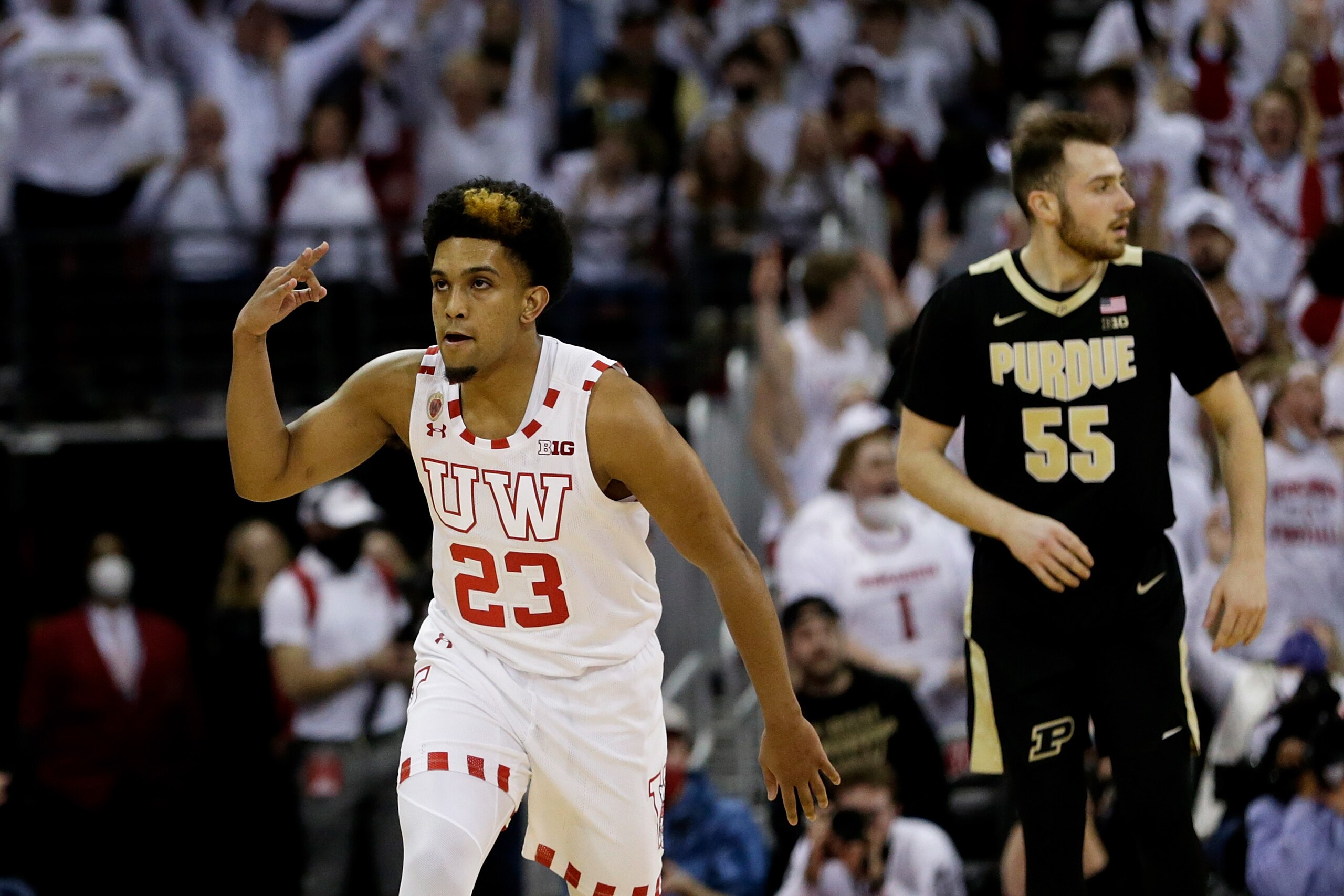 MADISON, WISCONSIN - MARCH 01: Chucky Hepburn #23 of the Wisconsin Badgers reacts after hitting a three-point shot during the first half of the game against the Purdue Boilermakers at Kohl Center on March 01, 2022 in Madison, Wisconsin. (Photo by John Fisher/Getty Images)