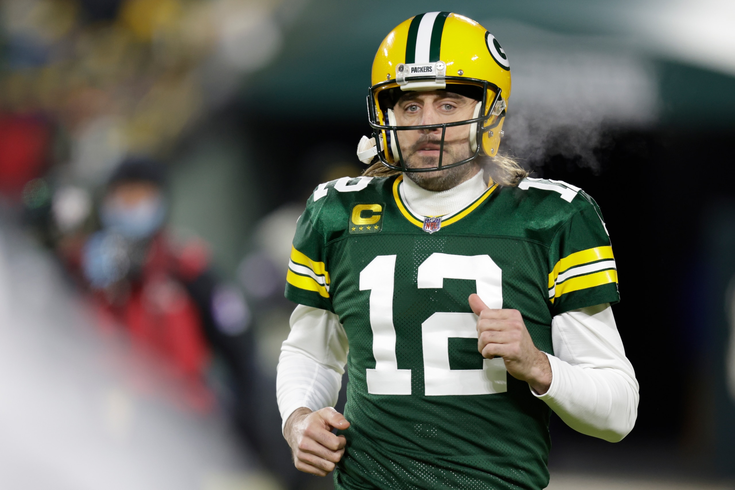 Green Bay Packers' Aaron Rodgers warms up before an NFC divisional playoff NFL football game against the San Francisco 49ers Saturday, Jan. 22, 2022, in Green Bay, Wis. (AP Photo/Matt Ludtke)
