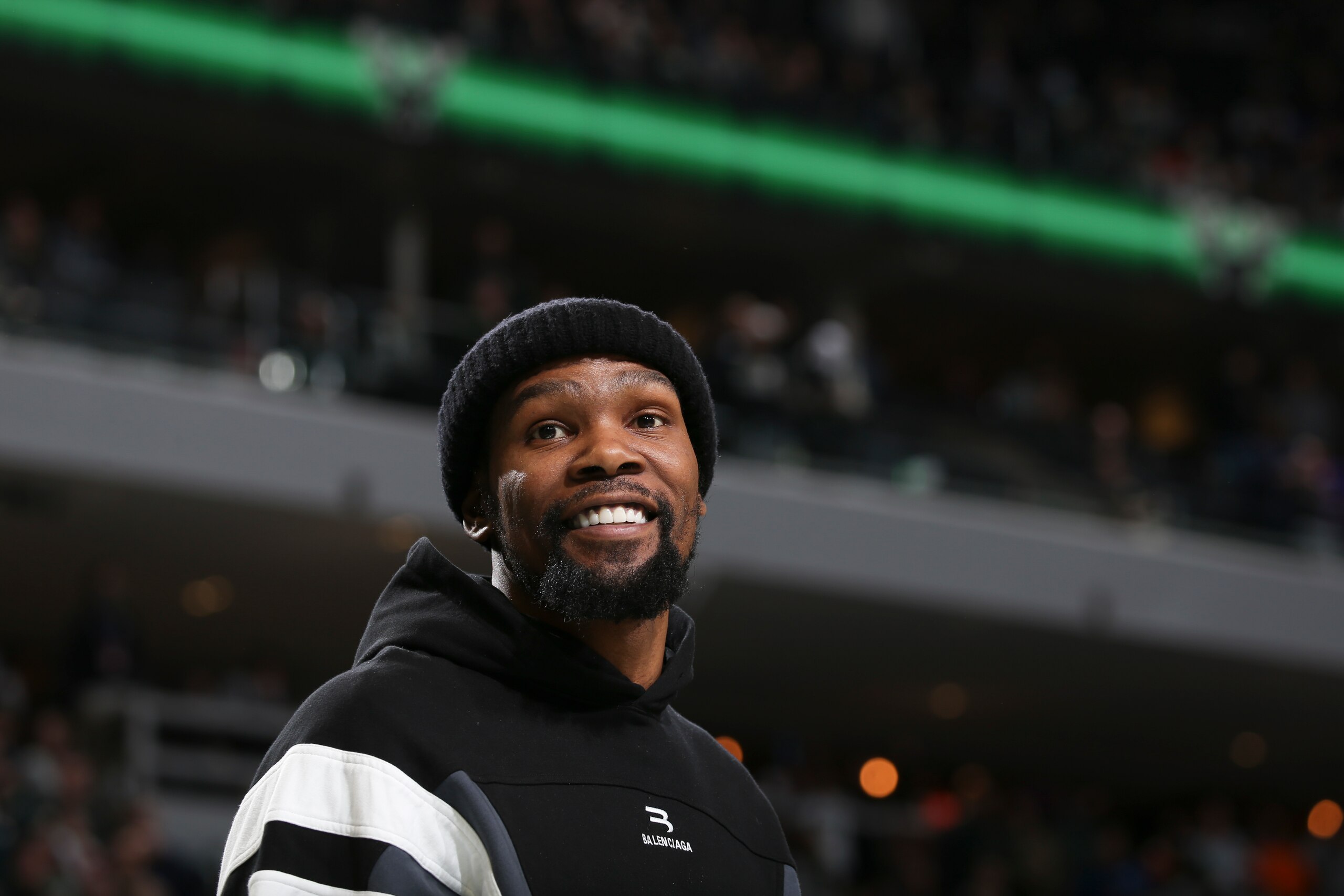 MILWAUKEE, WI - FEBRUARY 26: Kevin Durant #7 of the Brooklyn Nets smiles during the game against the Milwaukee Bucks on February 26, 2022 at the Fiserv Forum Center in Milwaukee, Wisconsin. NOTE TO USER: User expressly acknowledges and agrees that, by downloading and or using this Photograph, user is consenting to the terms and conditions of the Getty Images License Agreement. Mandatory Copyright Notice: Copyright 2022 NBAE (Photo by Gary Dineen/NBAE via Getty Images).