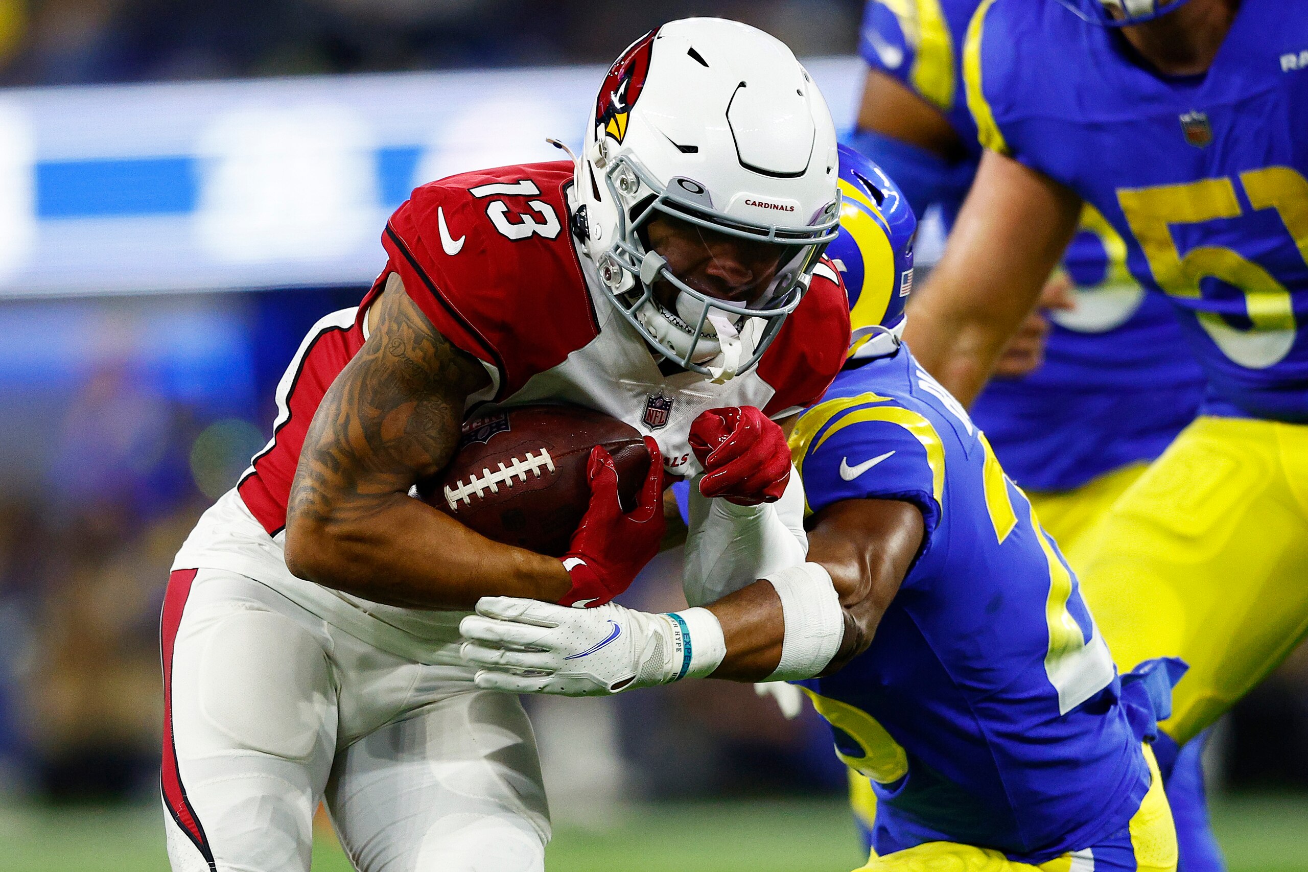INGLEWOOD, CALIFORNIA - JANUARY 17: Christian Kirk #13 of the Arizona Cardinals carries the ball against the Los Angeles Rams during the third quarter in the NFC Wild Card Playoff game at SoFi Stadium on January 17, 2022 in Inglewood, California. (Photo by Ronald Martinez/Getty Images)