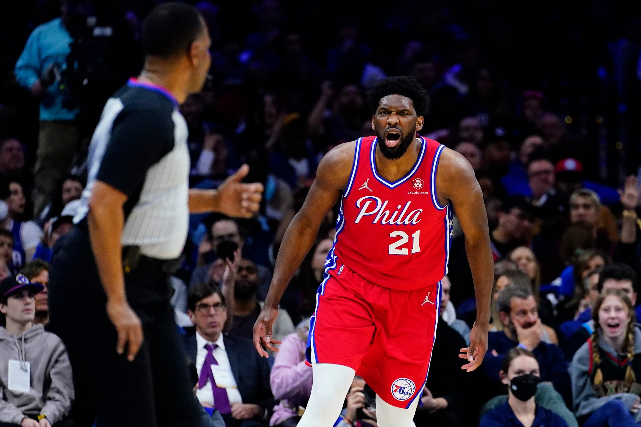 Philadelphia 76ers' Joel Embiid, right, reacts to referee James Capers during the first half of an NBA basketball gameagainst the New York Knicks, Wednesday, March 2, 2022, in Philadelphia. (AP Photo/Matt Slocum)