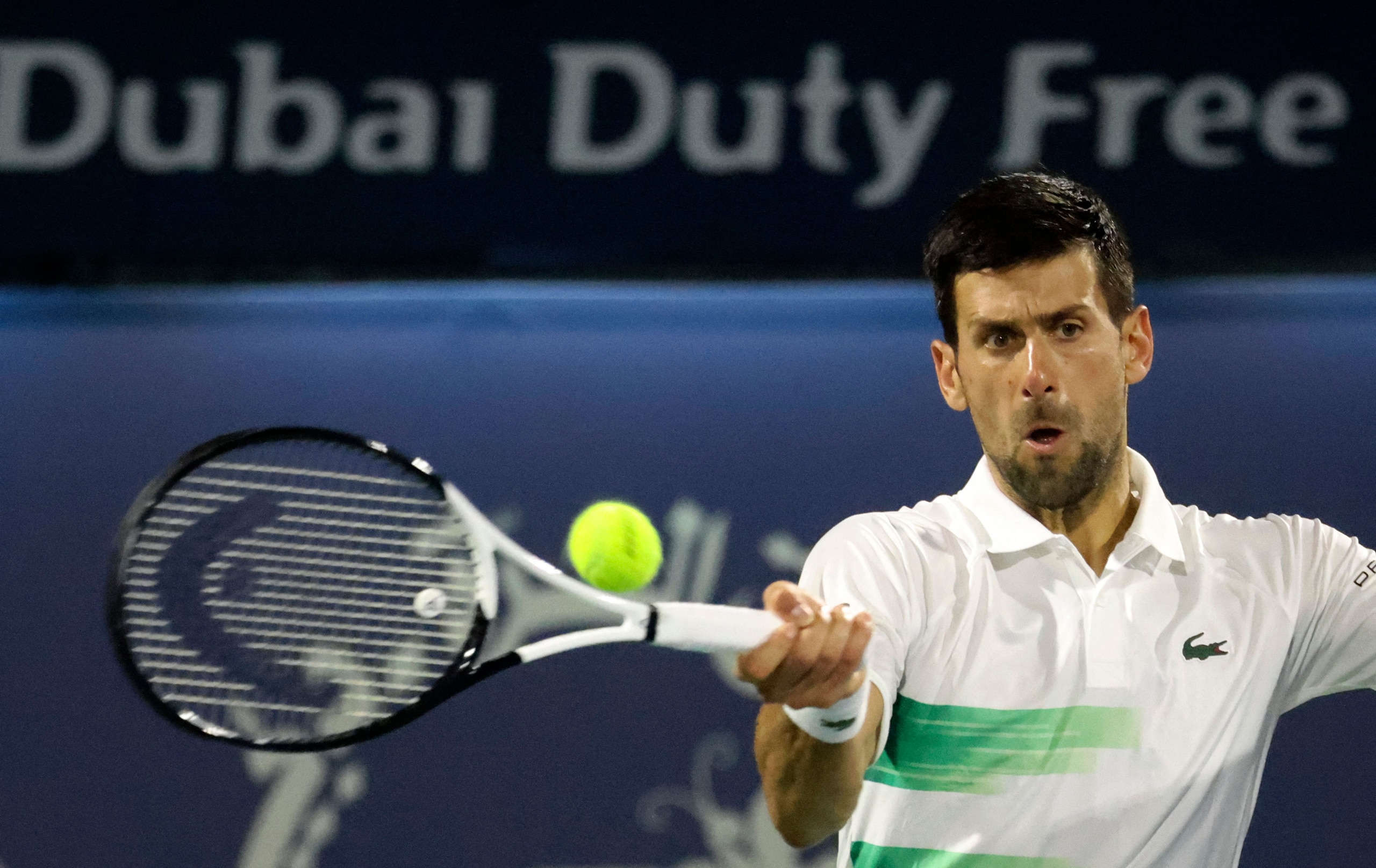 Serbia's Novak Djokovic returns the ball to Czech Republic's Jiri Vesely during their quarter-final match at the ATP Dubai Duty Free Tennis Championship, in the Gulf emirate on February 24, 2022. (Photo by Karim SAHIB / AFP) (Photo by KARIM SAHIB/AFP via Getty Images)