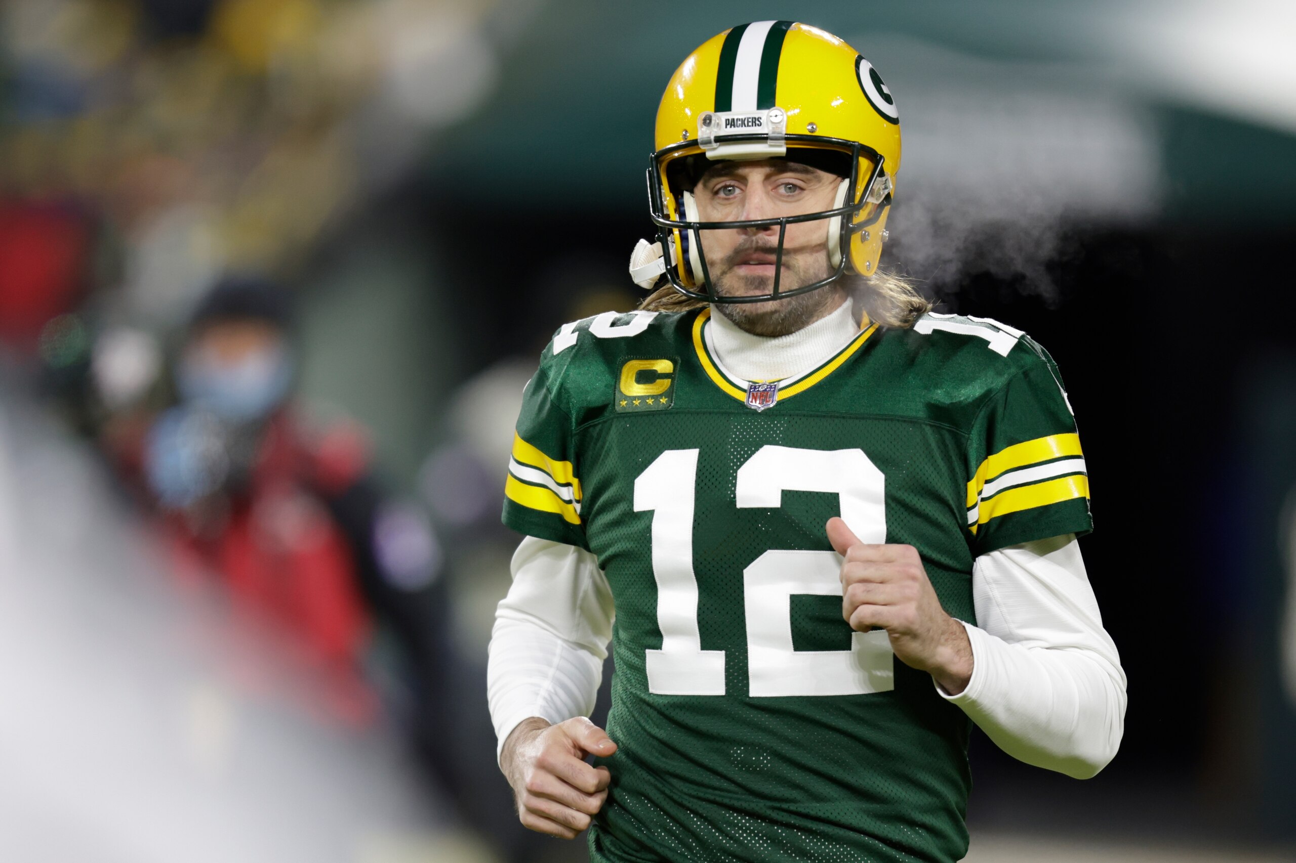Green Bay Packers' Aaron Rodgers warms up before an NFC divisional playoff NFL football game against the San Francisco 49ers Saturday, Jan. 22, 2022, in Green Bay, Wis. (AP Photo/Matt Ludtke) Green Bay Packers' Aaron Rodgers warms up before an NFC divisional playoff NFL football game against the San Francisco 49ers Saturday, Jan. 22, 2022, in Green Bay, Wis. (AP Photo/Matt Ludtke)
