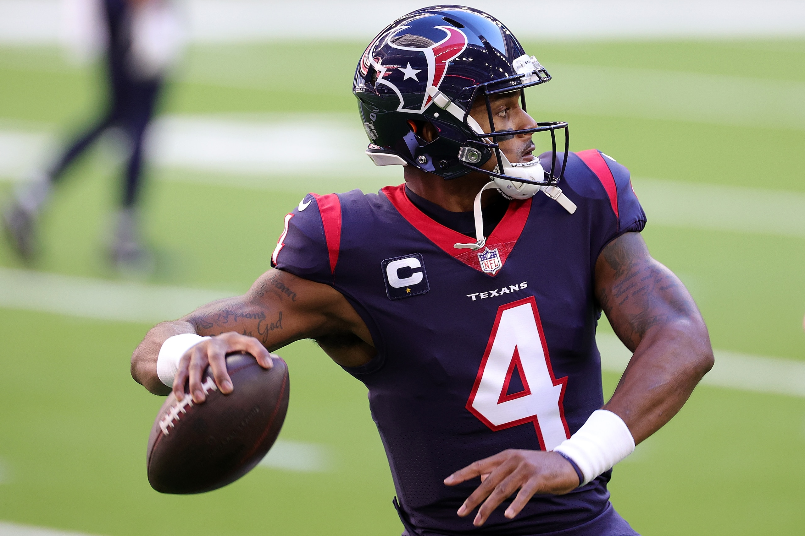 HOUSTON, TEXAS - JANUARY 03: Deshaun Watson #4 of the Houston Texans participates in warmups prior to a game against the Tennessee Titans at NRG Stadium on January 03, 2021 in Houston, Texas. (Photo by Carmen Mandato/Getty Images)