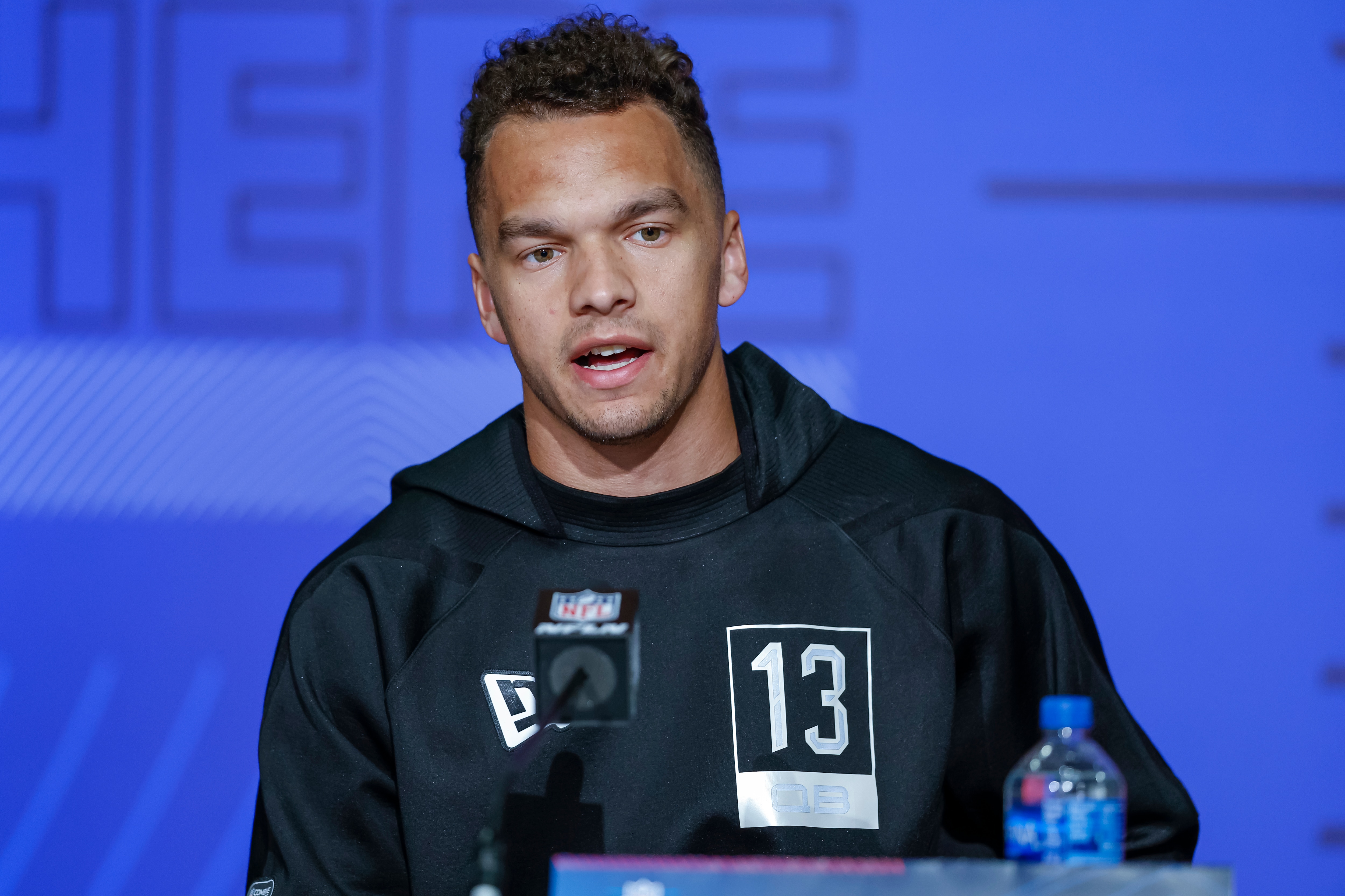 INDIANAPOLIS, IN - MAR 02: Desmond Ridder #QB13 of the Cincinnati Bearcats speaks to reporters during the NFL Draft Combine at the Indiana Convention Center on March 2, 2022 in Indianapolis, Indiana. (Photo by Michael Hickey/Getty Images)