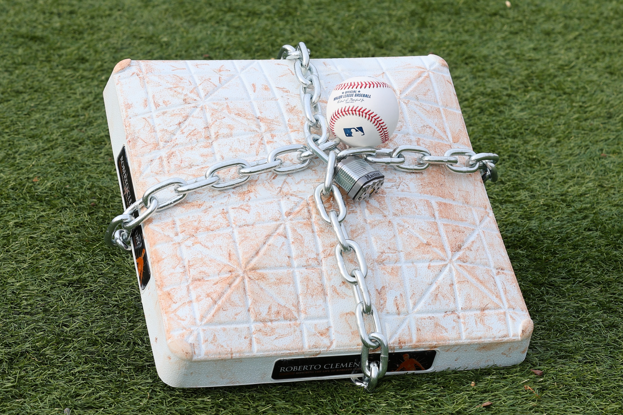 LINCROFT, NJ - JANUARY 28:  An official MLB baseball sits on top of an MLB game-used base with a lock and chain around it to represent the lockout between Major League Baseball (MLB) and the Major League Baseball Players Association (MLBPA) on January 28, 2022  in Lincroft, New Jersey.  (Photo by Rich Graessle/Icon Sportswire via Getty Images)