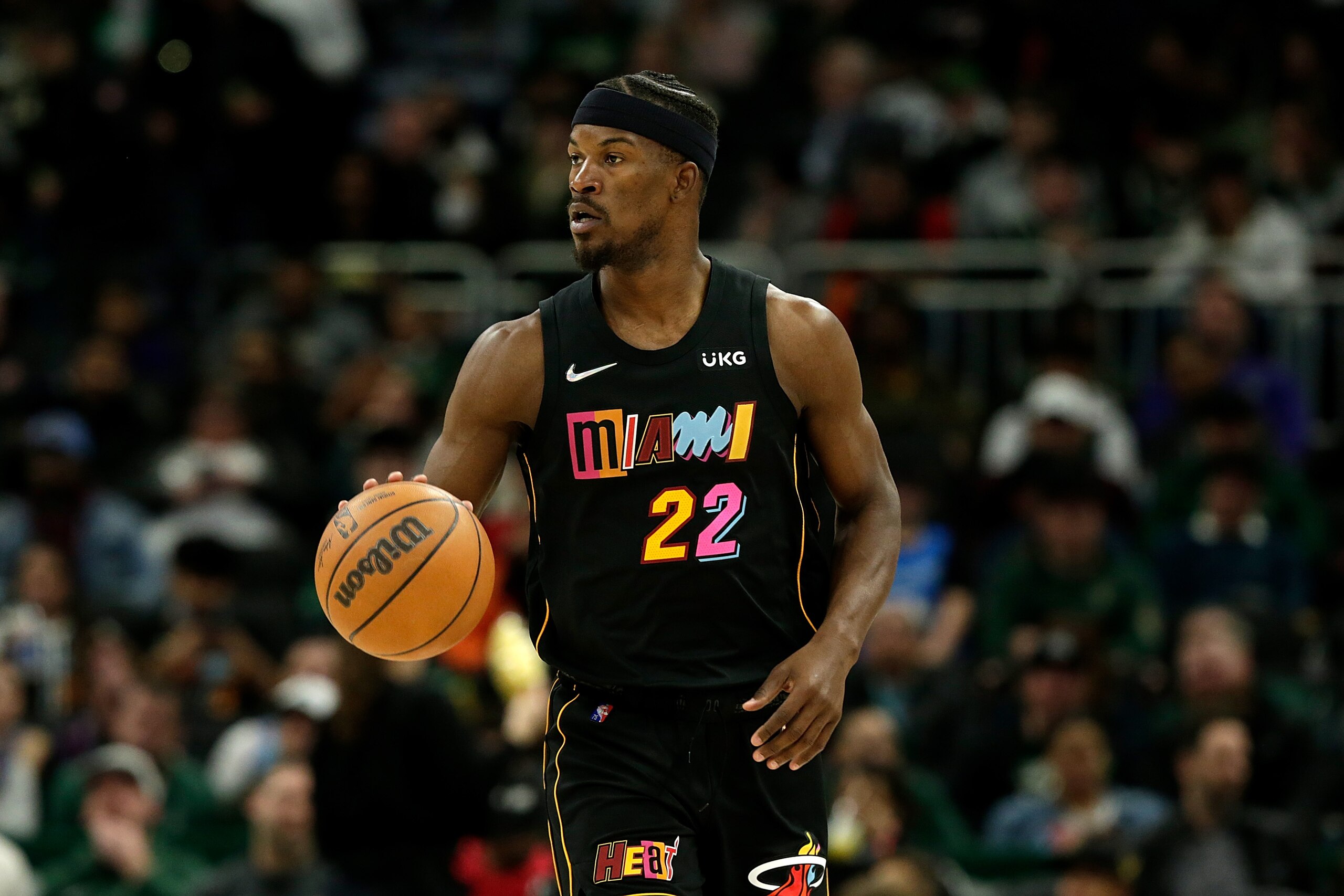 MILWAUKEE, WISCONSIN - MARCH 02: Jimmy Butler #22 of the Miami Heat dribbles the basketball down court during the second half of the game against the Milwaukee Bucks at Fiserv Forum on March 02, 2022 in Milwaukee, Wisconsin. Bucks defeated the Heat 120-119. NOTE TO USER: User expressly acknowledges and agrees that, by downloading and or using this photograph, User is consenting to the terms and conditions of the Getty Images License Agreement. (Photo by John Fisher/Getty Images)