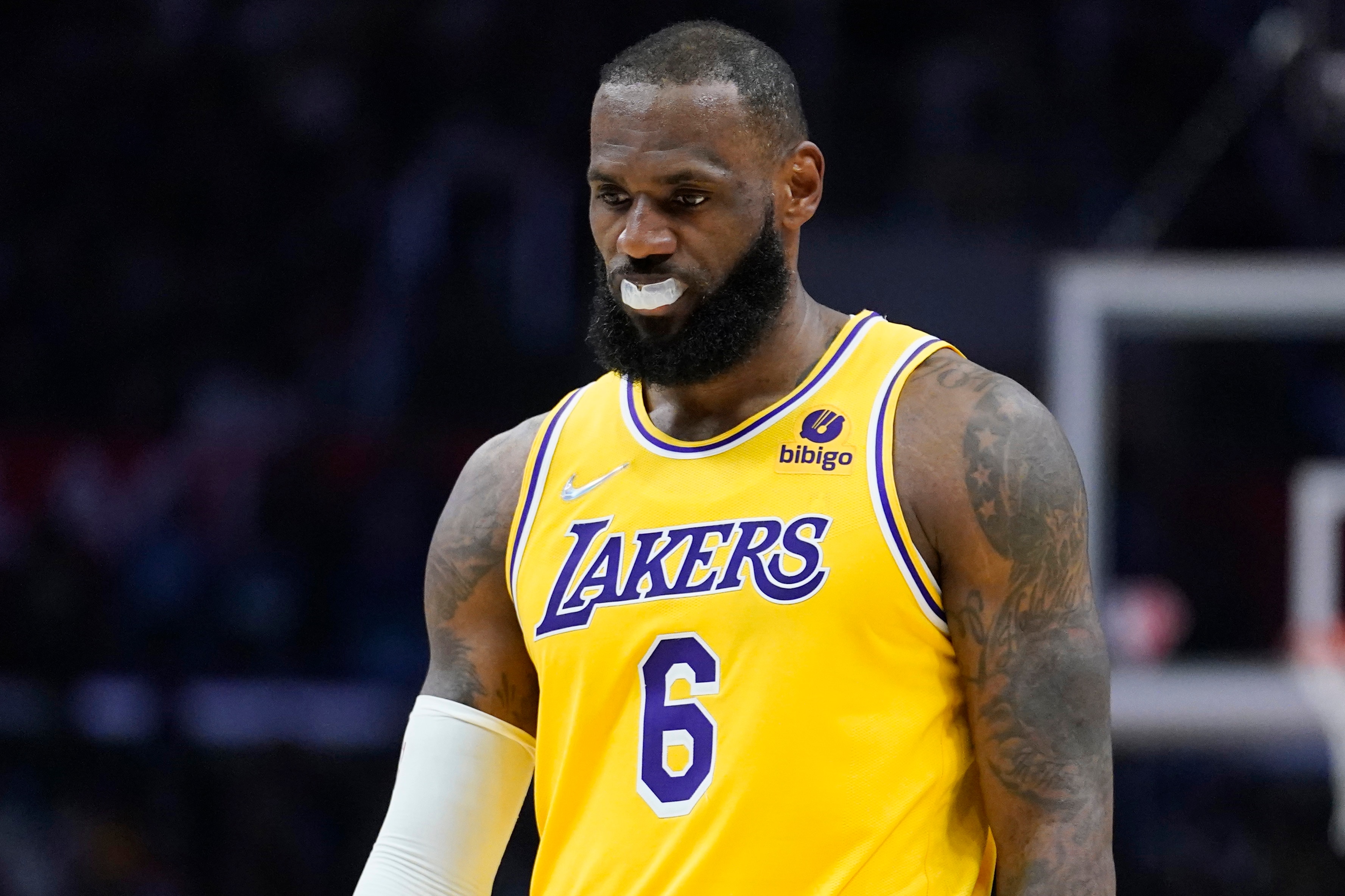 Los Angeles Lakers forward LeBron James (6) looks down during a break in play during the second half of the team's NBA basketball game against the Los Angeles Clippers on Thursday, March 3, 2022, in Los Angeles. (AP Photo/Marcio Jose Sanchez)