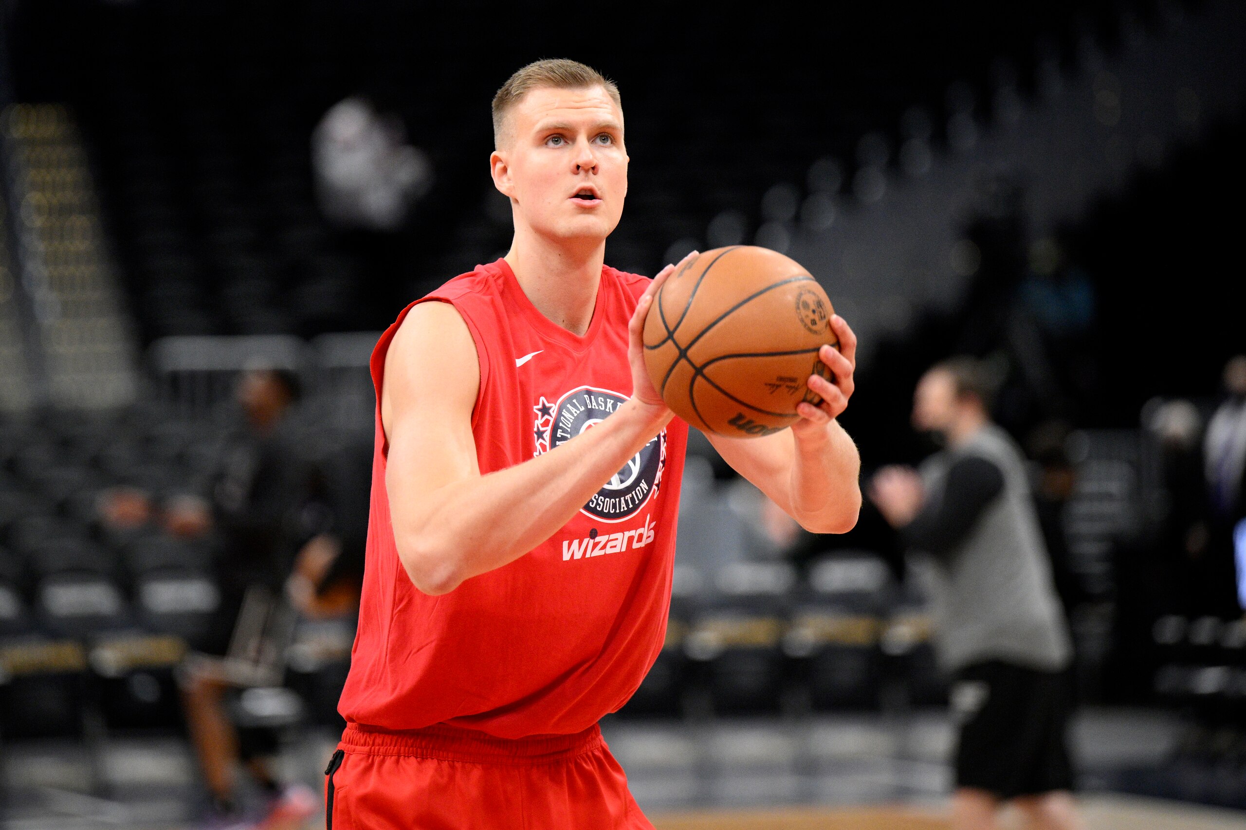 Washington Wizards center Kristaps Porzingis works out before an NBA basketball game against the Sacramento Kings, Saturday, Feb. 12, 2022, in Washington. (AP Photo/Nick Wass)