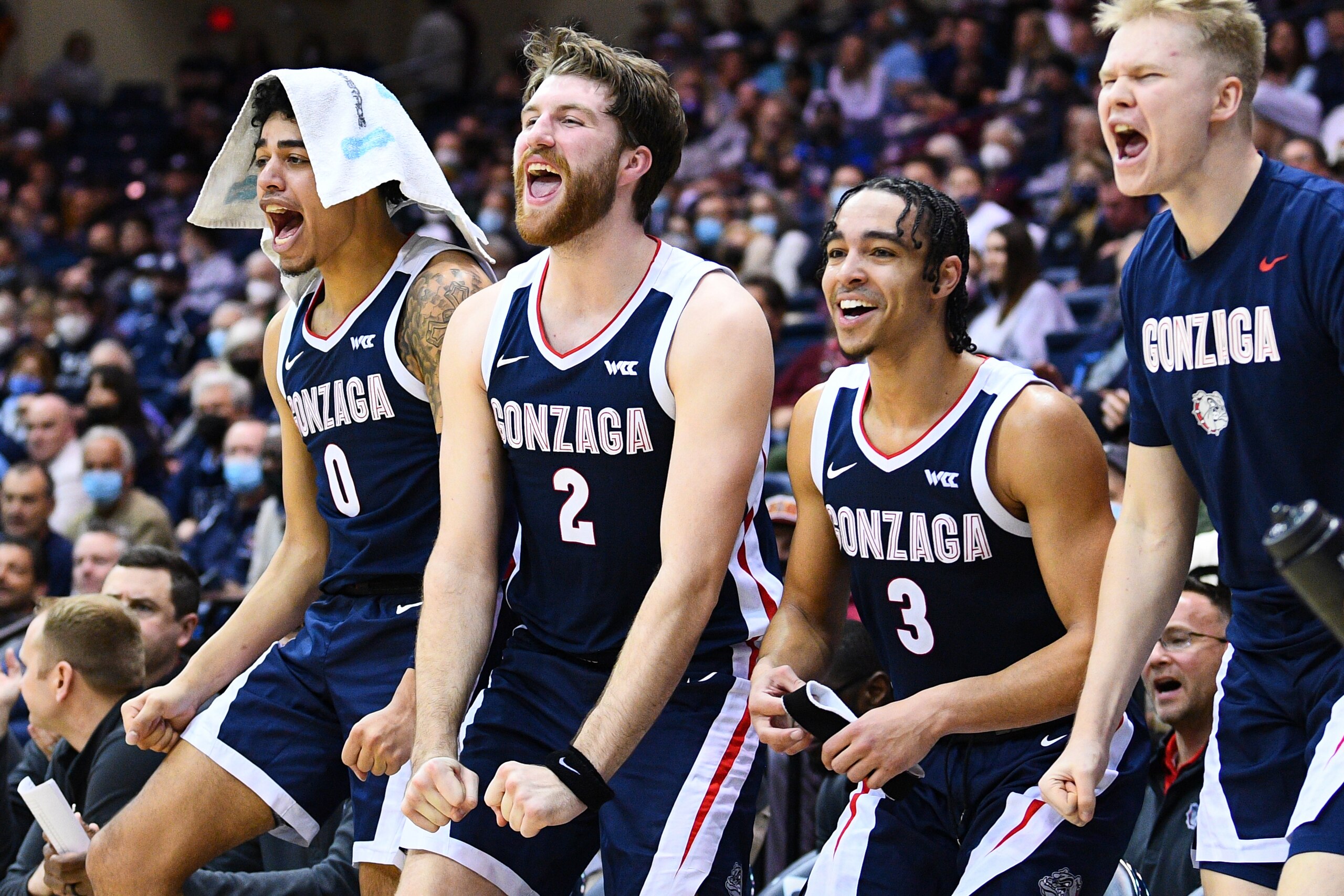 SAN DIEGO, CA - FEBRUARY 03: Gonzaga guard Julian Strawther (0), Gonzaga forward Drew Timme (2) and Gonzaga guard Andrew Nembhard (3) celebrate on the bench during the college basketball game between the Gonzaga Bulldogs and the USD Toreros on February 3, 2022 at the Jenny Craig Pavilion in San Diego, CA. (Photo by Brian Rothmuller/Icon Sportswire via Getty Images) SAN DIEGO, CA - FEBRUARY 03: Gonzaga guard Julian Strawther (0), Gonzaga forward Drew Timme (2) and Gonzaga guard Andrew Nembhard (3) celebrate on the bench during the college basketball game between the Gonzaga Bulldogs and the USD Toreros on February 3, 2022 at the Jenny Craig Pavilion in San Diego, CA. (Photo by Brian Rothmuller/Icon Sportswire via Getty Images)