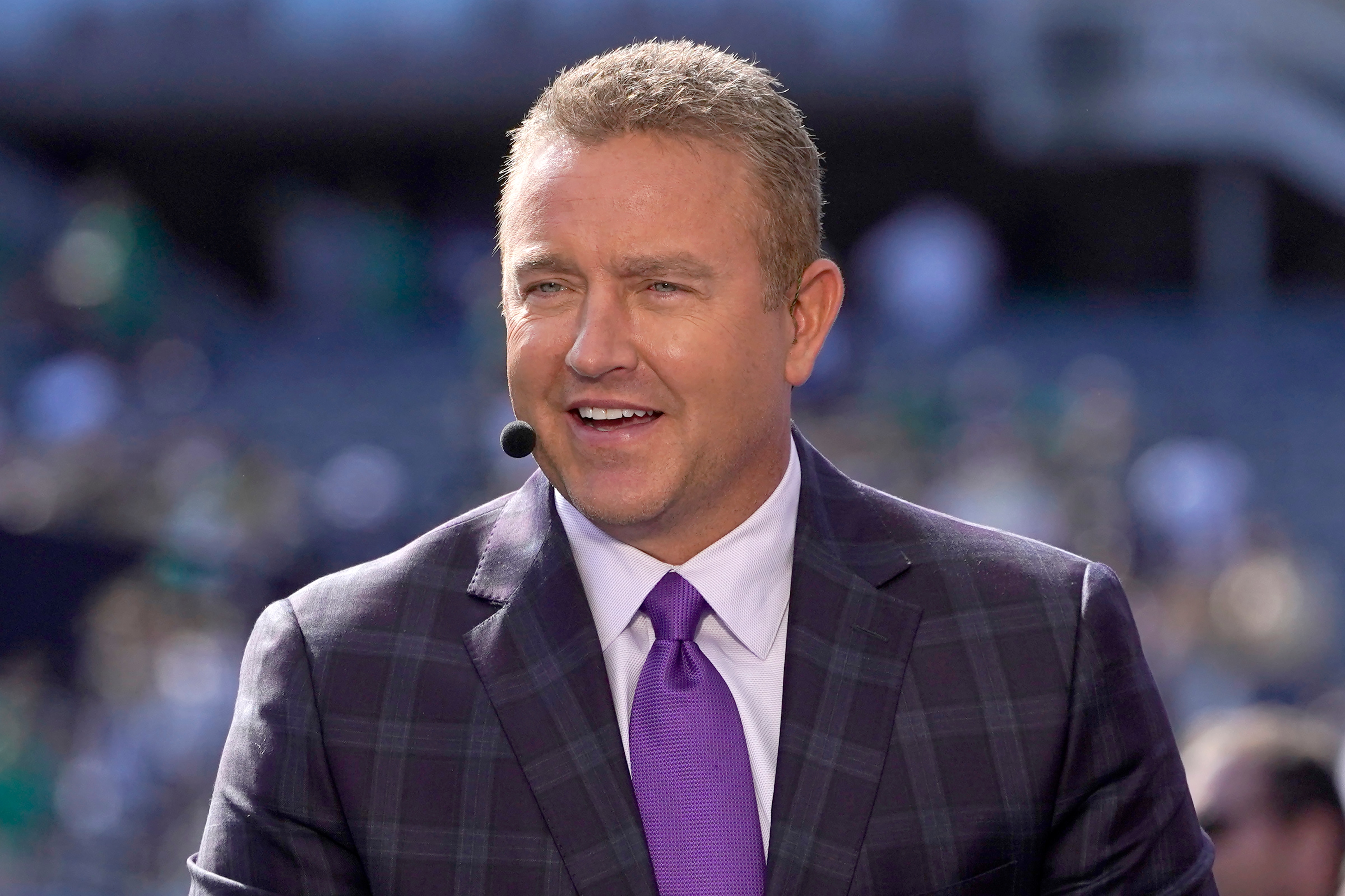 Kirk Herbstreit talks on the set of ESPN's College Game Day program in Soldier Field before an NCAA college football game between Wisconsin and Notre Dame Saturday, Sept. 25, 2021, in Chicago. (AP Photo/Charles Rex Arbogast)