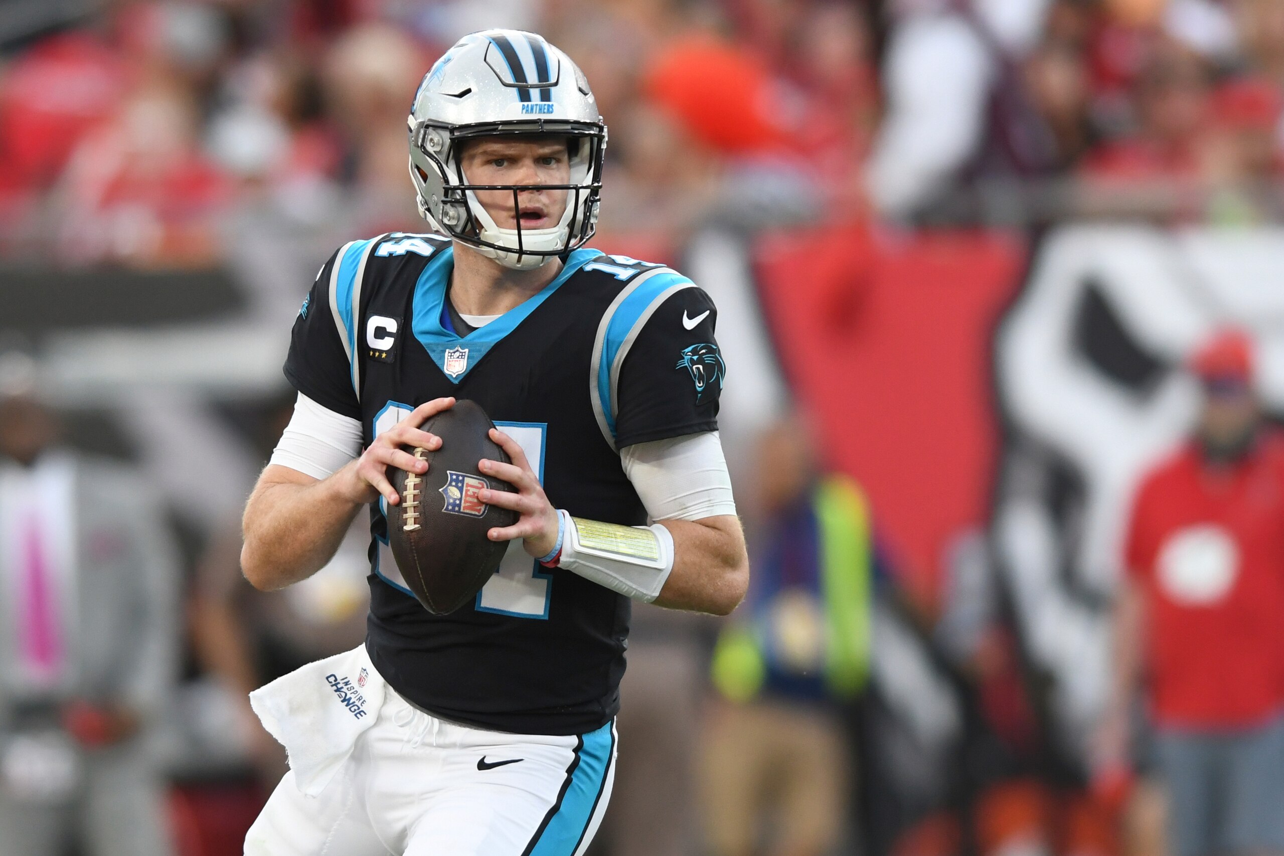 Carolina Panthers quarterback Sam Darnold (14) looks to pass against the Tampa Bay Buccaneers during the first half of an NFL football game Sunday, Jan. 9, 2022, in Tampa, Fla. (AP Photo/Jason Behnken)