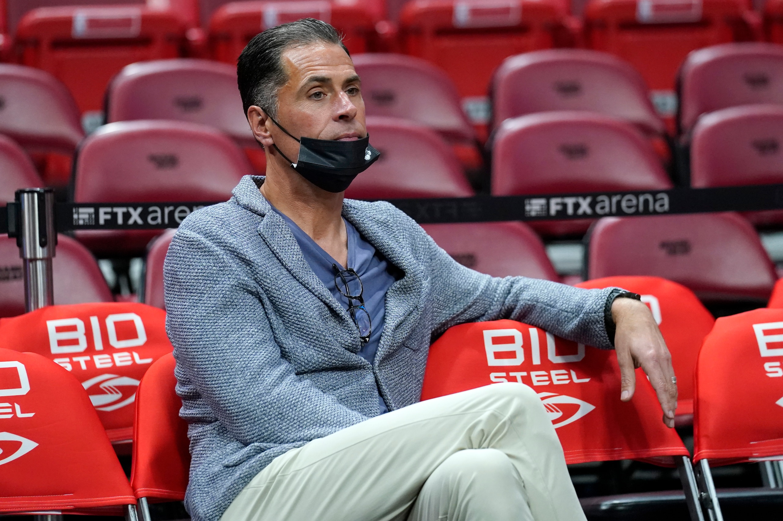 Los Angeles Lakers General Manager Rob Pelinka watches players warm up before an NBA basketball game against the Miami Heat, Sunday, Jan. 23, 2022, in Miami. (AP Photo/Lynne Sladky)