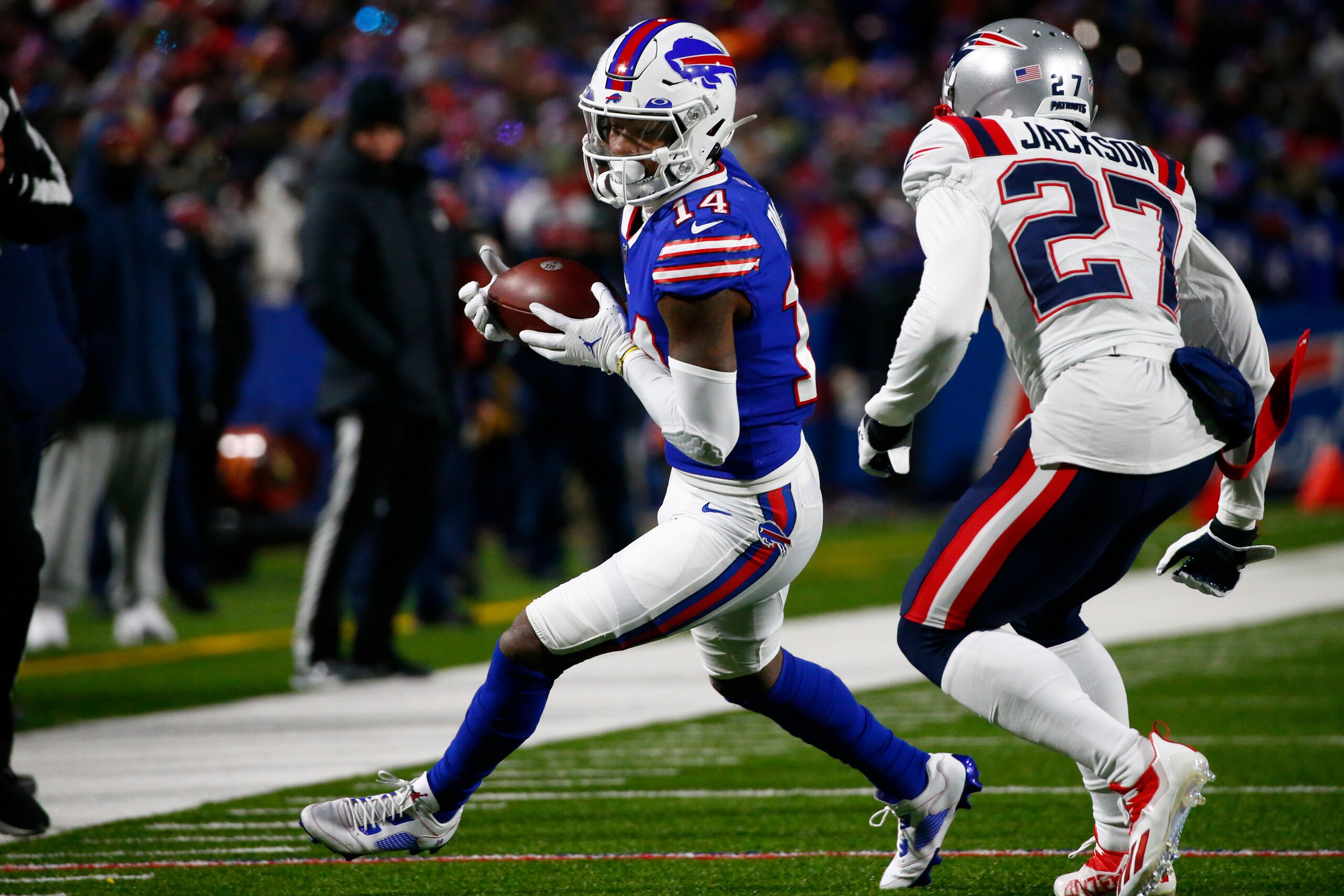 Buffalo Bills wide receiver Stefon Diggs (14) makes a catch during the first half of an NFL wild-card playoff football game against the New England Patriots in Orchard Park, N.Y., Saturday, Jan. 15, 2022. (AP Photo/ Jeffrey T. Barnes)