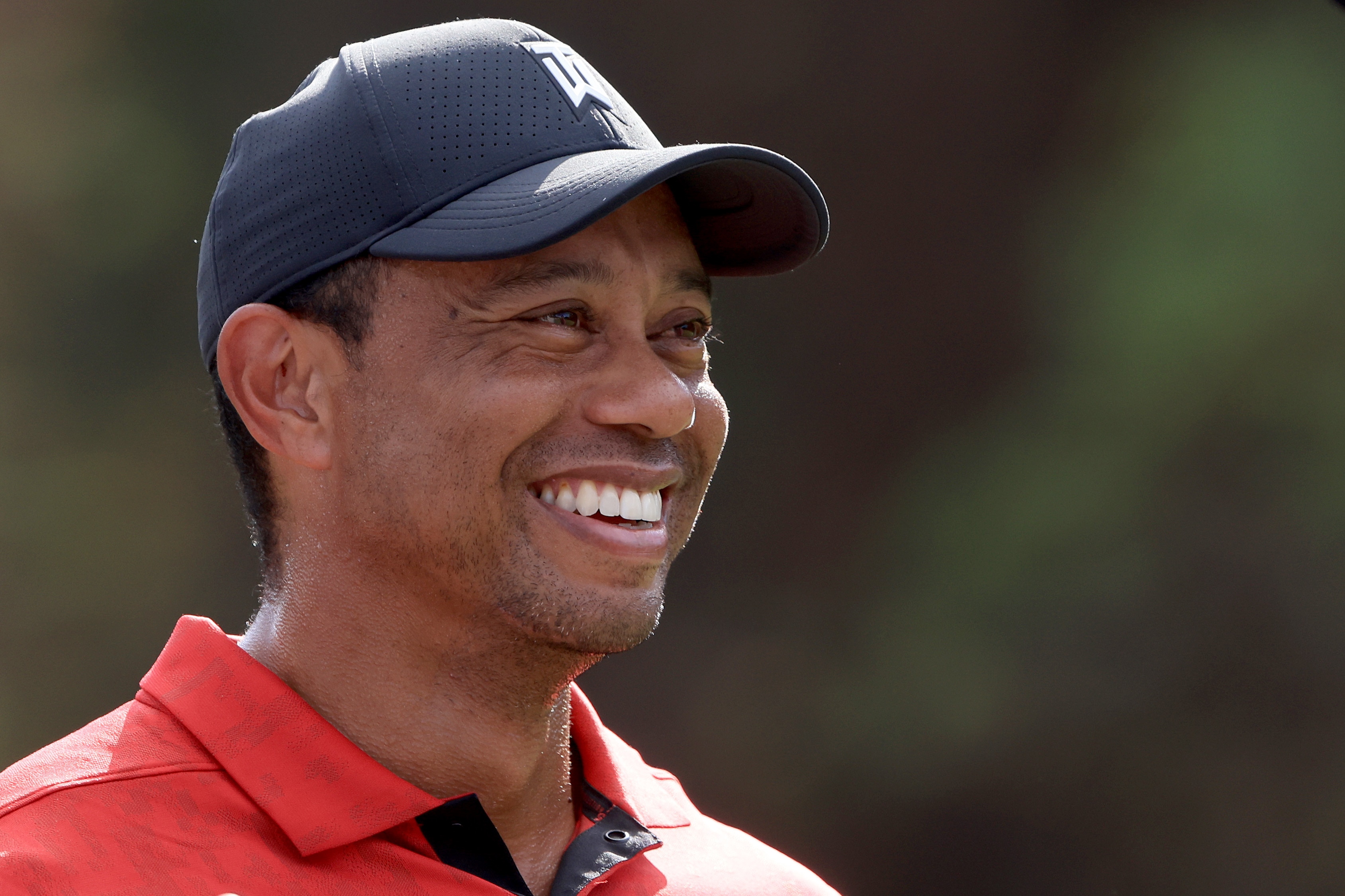 ORLANDO, FLORIDA - DECEMBER 19: Tiger Woods smiles on the 13th hole during the final round of the PNC Championship at the Ritz Carlton Golf Club Grande Lakes   on December 19, 2021 in Orlando, Florida. (Photo by Sam Greenwood/Getty Images)