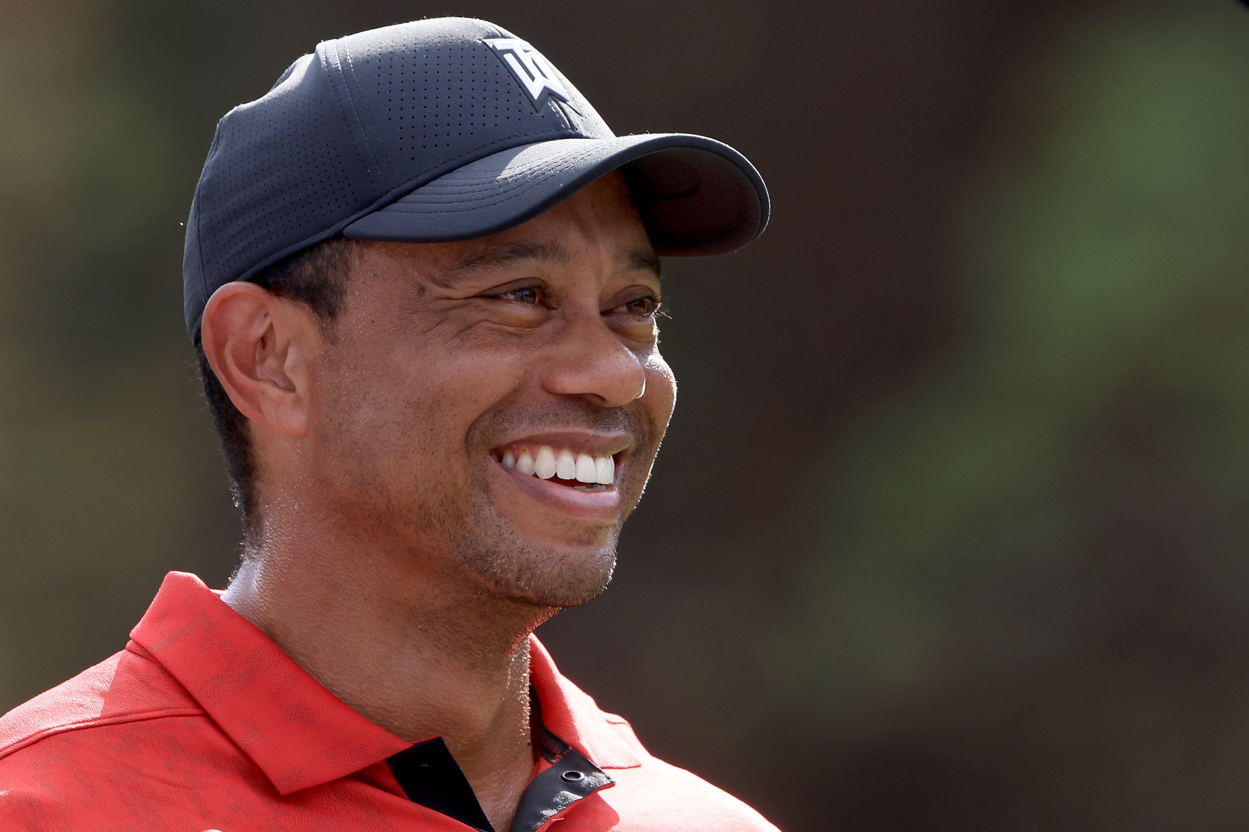 ORLANDO, FLORIDA - DECEMBER 19: Tiger Woods smiles on the 13th hole during the final round of the PNC Championship at the Ritz Carlton Golf Club Grande Lakes   on December 19, 2021 in Orlando, Florida. (Photo by Sam Greenwood/Getty Images)