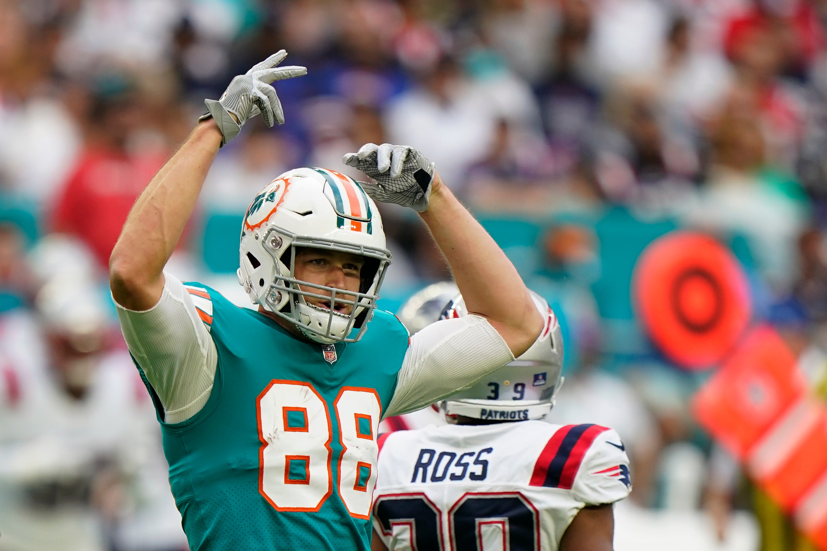 Miami Dolphins tight end Mike Gesicki (88) gestures during the first half of an NFL football game against the New England Patriots, Sunday, Jan. 9, 2022, in Miami Gardens, Fla. (AP Photo/Willfredo Lee)