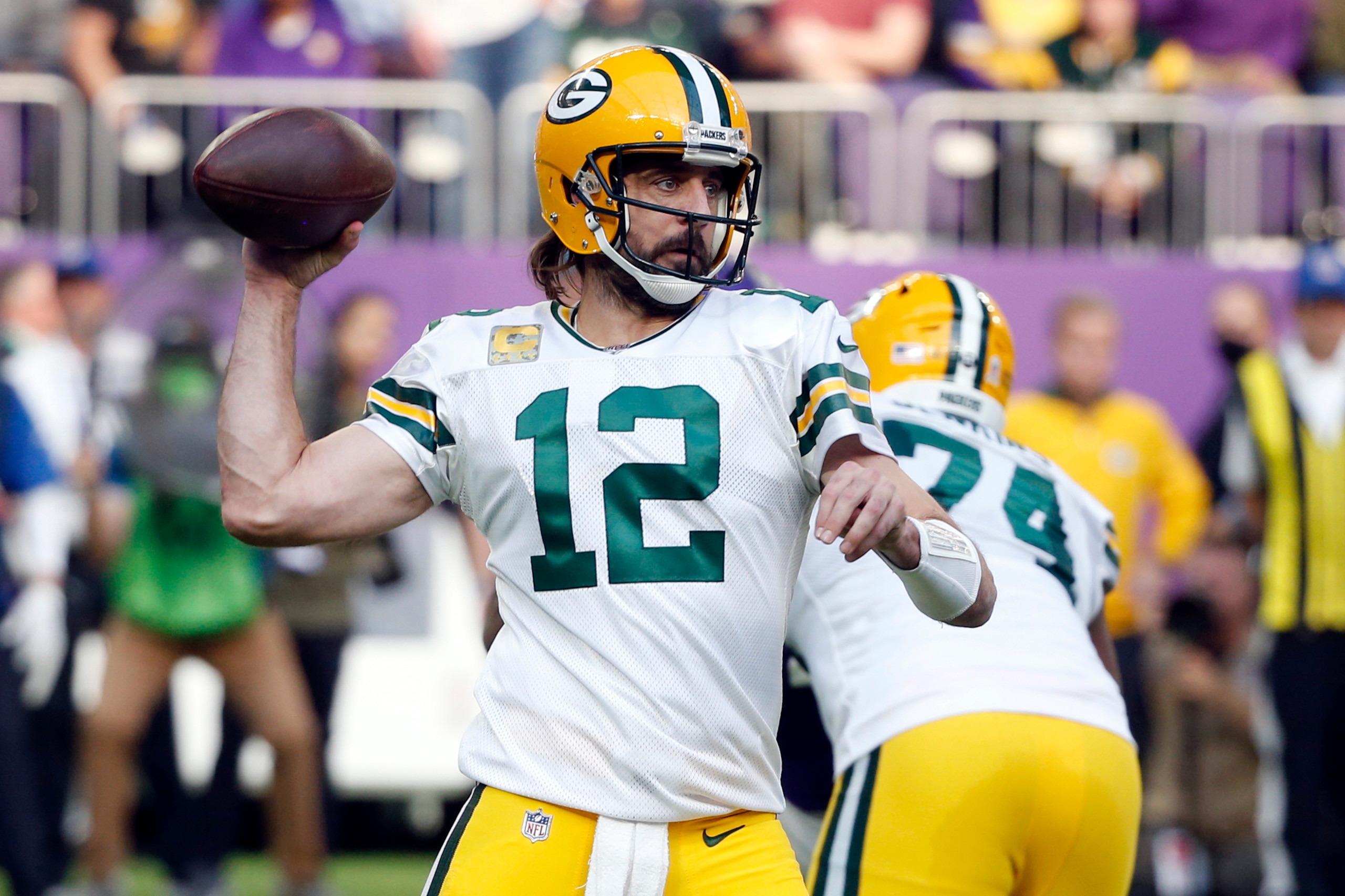 FILE - Green Bay Packers quarterback Aaron Rodgers (12) throws a pass during the first half of an NFL football game against the Minnesota Vikings, on Nov. 21, 2021, in Minneapolis. Rodgers was named to The Associated Press 2021 NFL All-Pro Team, announced Friday, Jan. 14, 2022.(AP Photo/Bruce Kluckhohn, File)