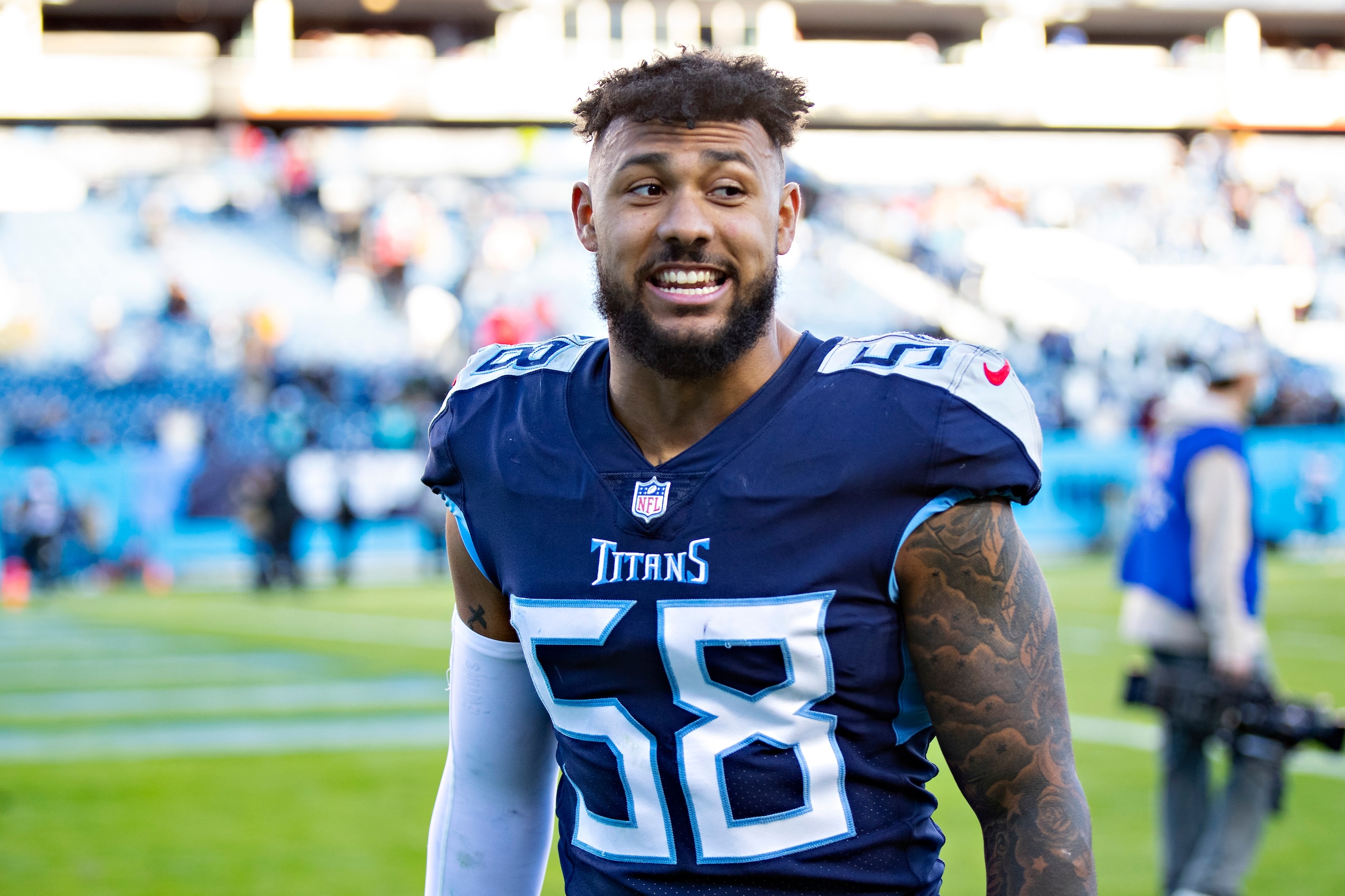 NASHVILLE, TENNESSEE - DECEMBER 12:  Harold Landry III #58 of the Tennessee Titans walks off the field after a game against the Jacksonville Jaguars at Nissan Stadium on December 12, 2021 in Nashville, Tennessee.  The Titans defeated the Jaguars 20-0.  (Photo by Wesley Hitt/Getty Images)