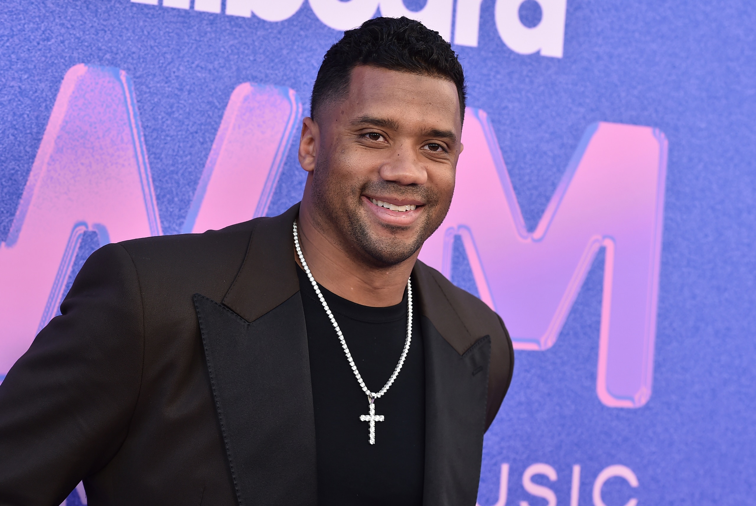 Russell Wilson arrives at the Billboard Women in Music Awards on Wednesday, March 2, 2022, at the YouTube Theater in Los Angeles. (Photo by Jordan Strauss/Invision/AP)