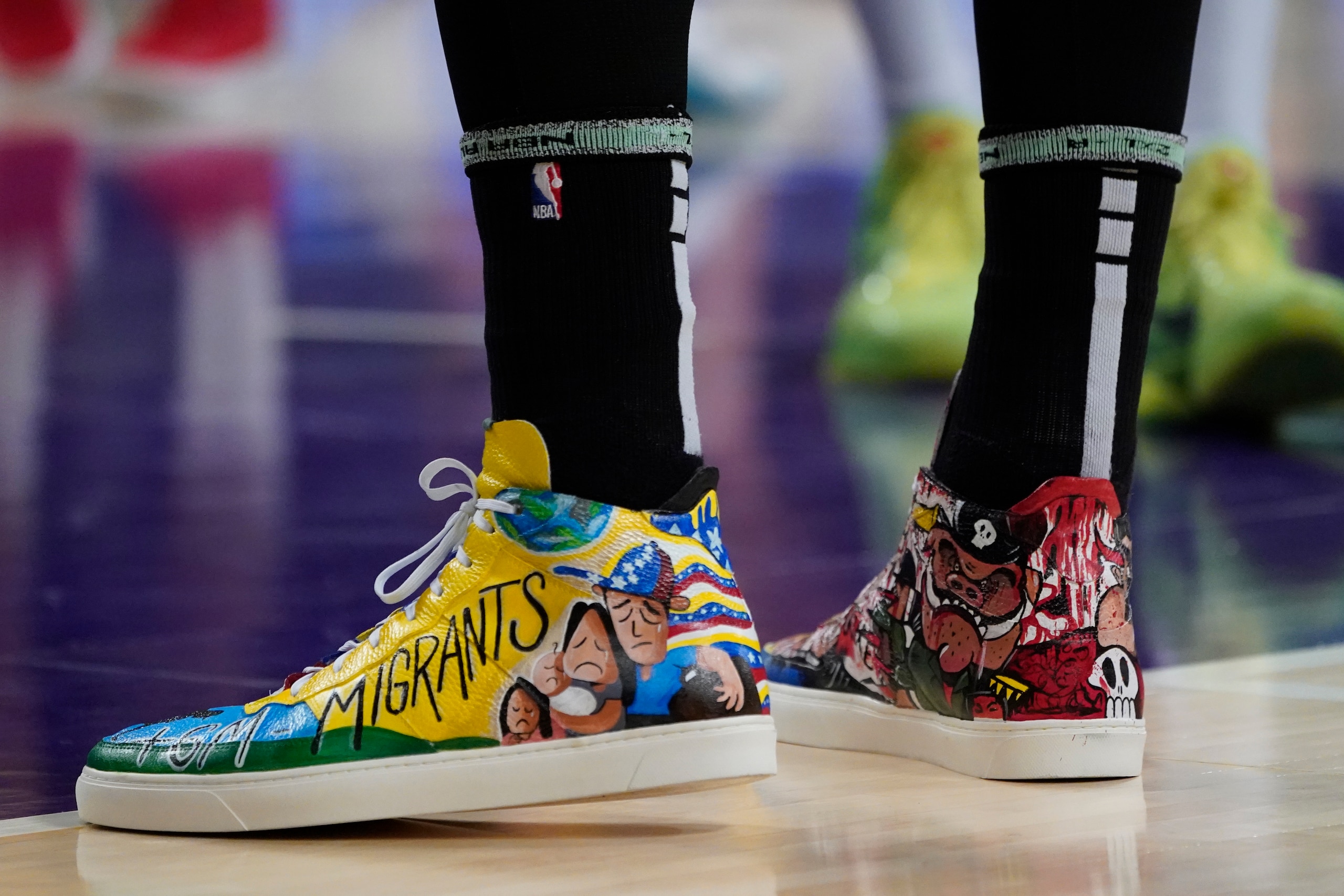 The sneakers of Boston Celtics center Enes Freedom are shown during the second half of an NBA basketball game against the Los Angeles Lakers Tuesday, Dec. 7, 2021, in Los Angeles. (AP Photo/Marcio Jose Sanchez)