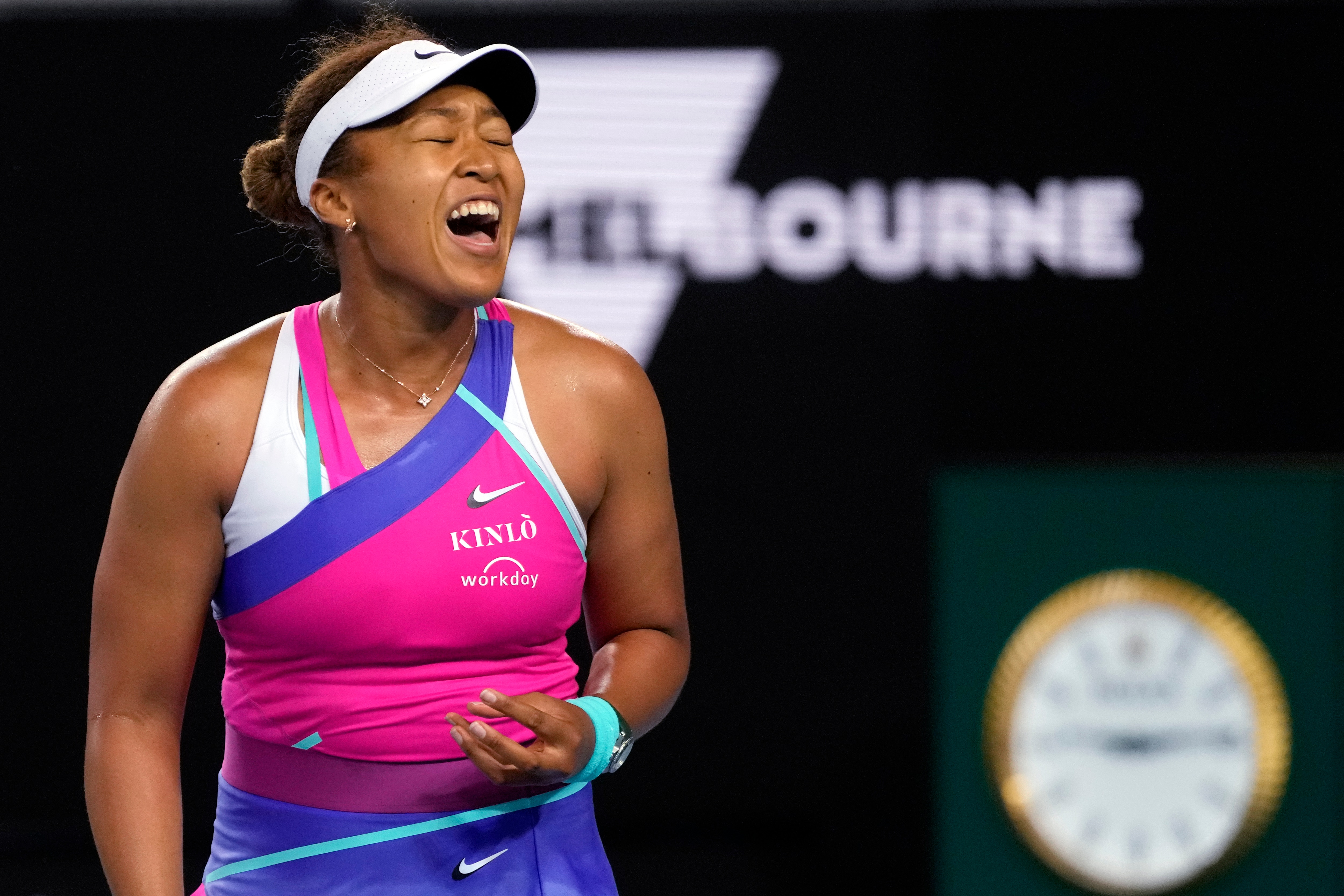 Naomi Osaka of Japan reacts during her third round match against Amanda Anisimova of the U.S. at the Australian Open tennis championships in Melbourne, Australia, Friday, Jan. 21, 2022. (AP Photo/Simon Baker)